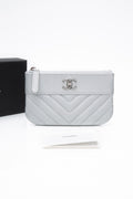 CHANEL Metallic Silver Caviar Chevron Quilted Small Mademoiselle Zip Pouch Case