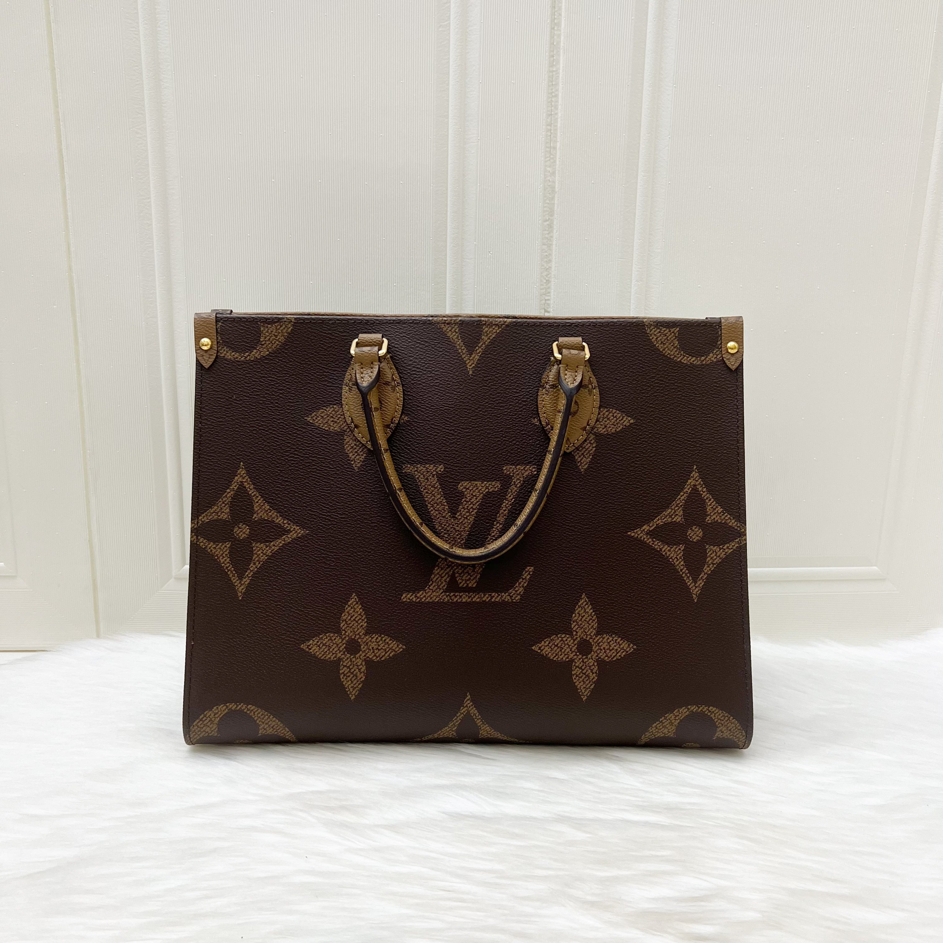 LV Onthego MM in Reverse Giant Monogram Canvas and GHW