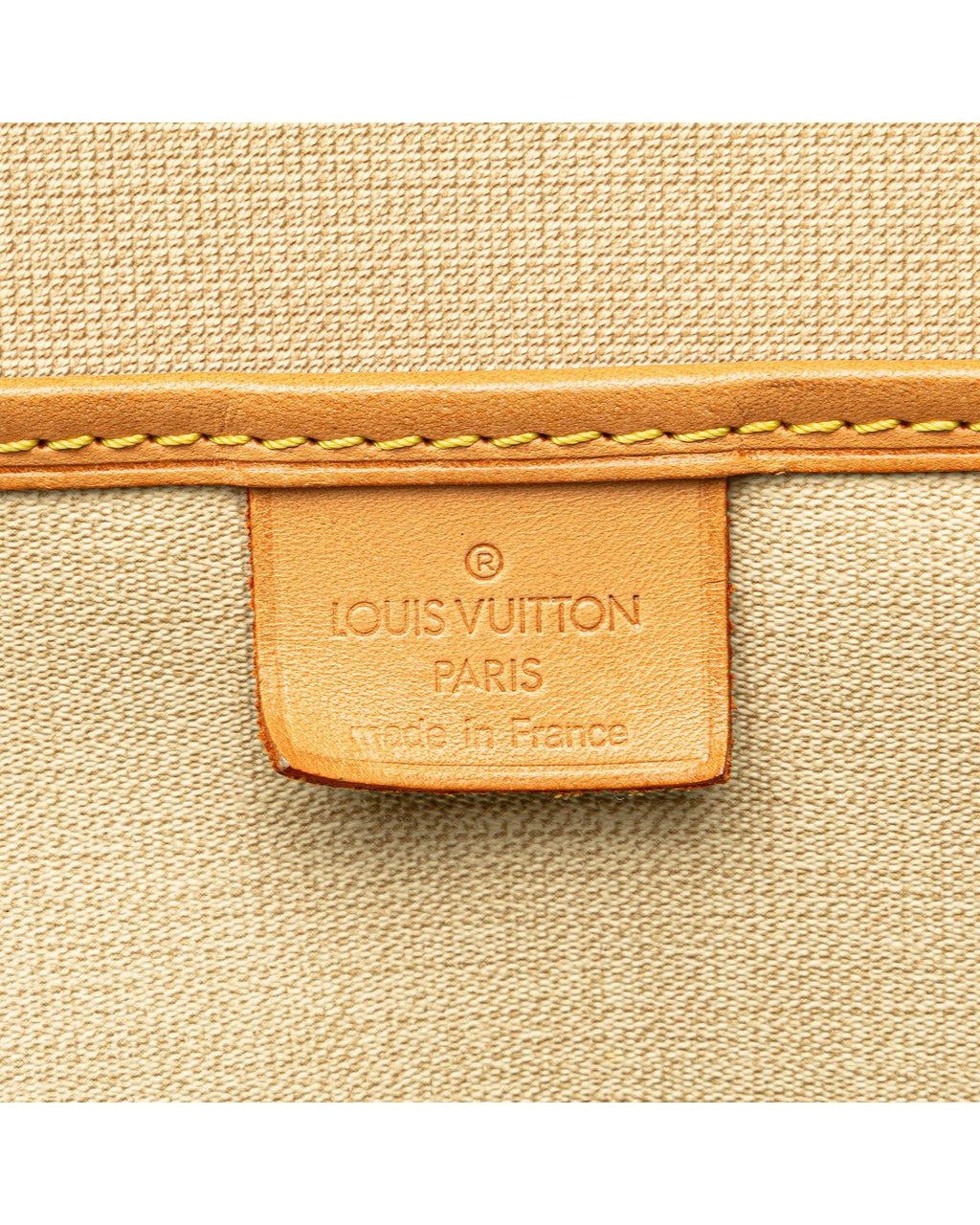Monogram Canvas Excursion Bag with Vachetta Leather Trim and Zip Closure