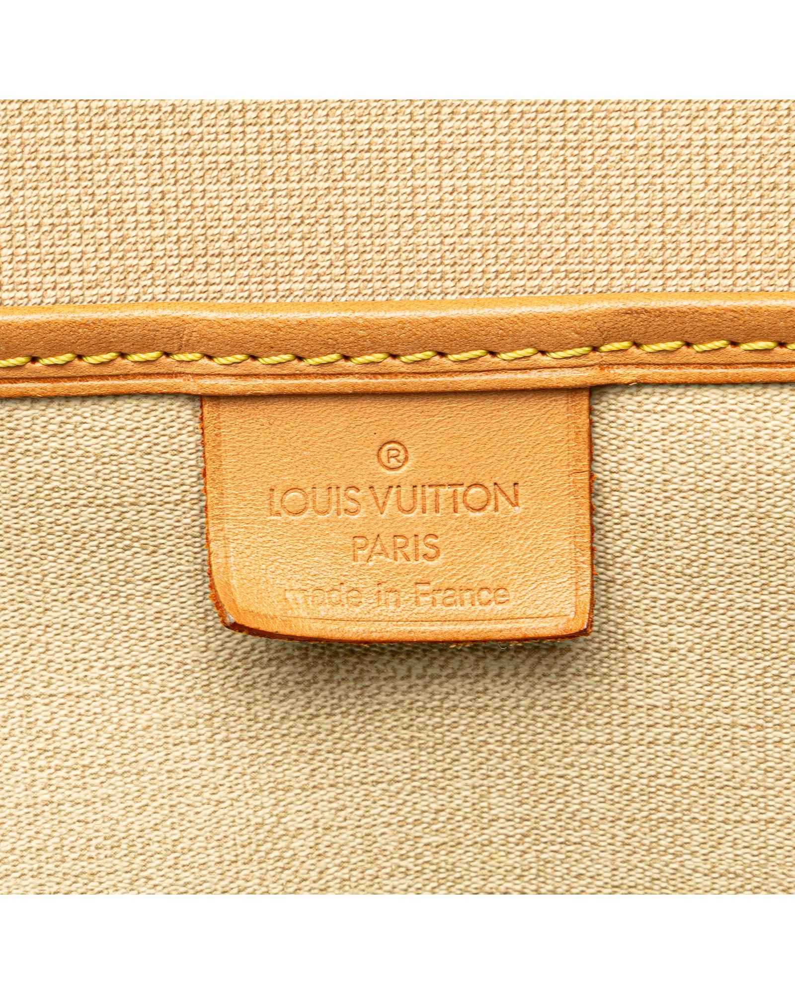 Monogram Canvas Excursion Bag with Vachetta Leather Trim and Zip Closure