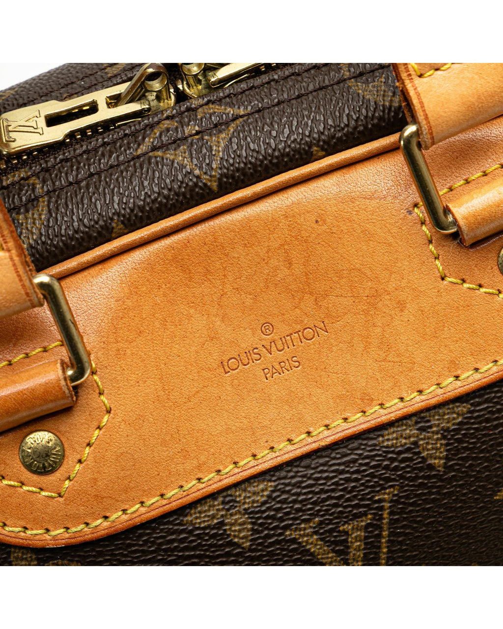 Monogram Canvas Excursion Bag with Vachetta Leather Trim and Zip Closure