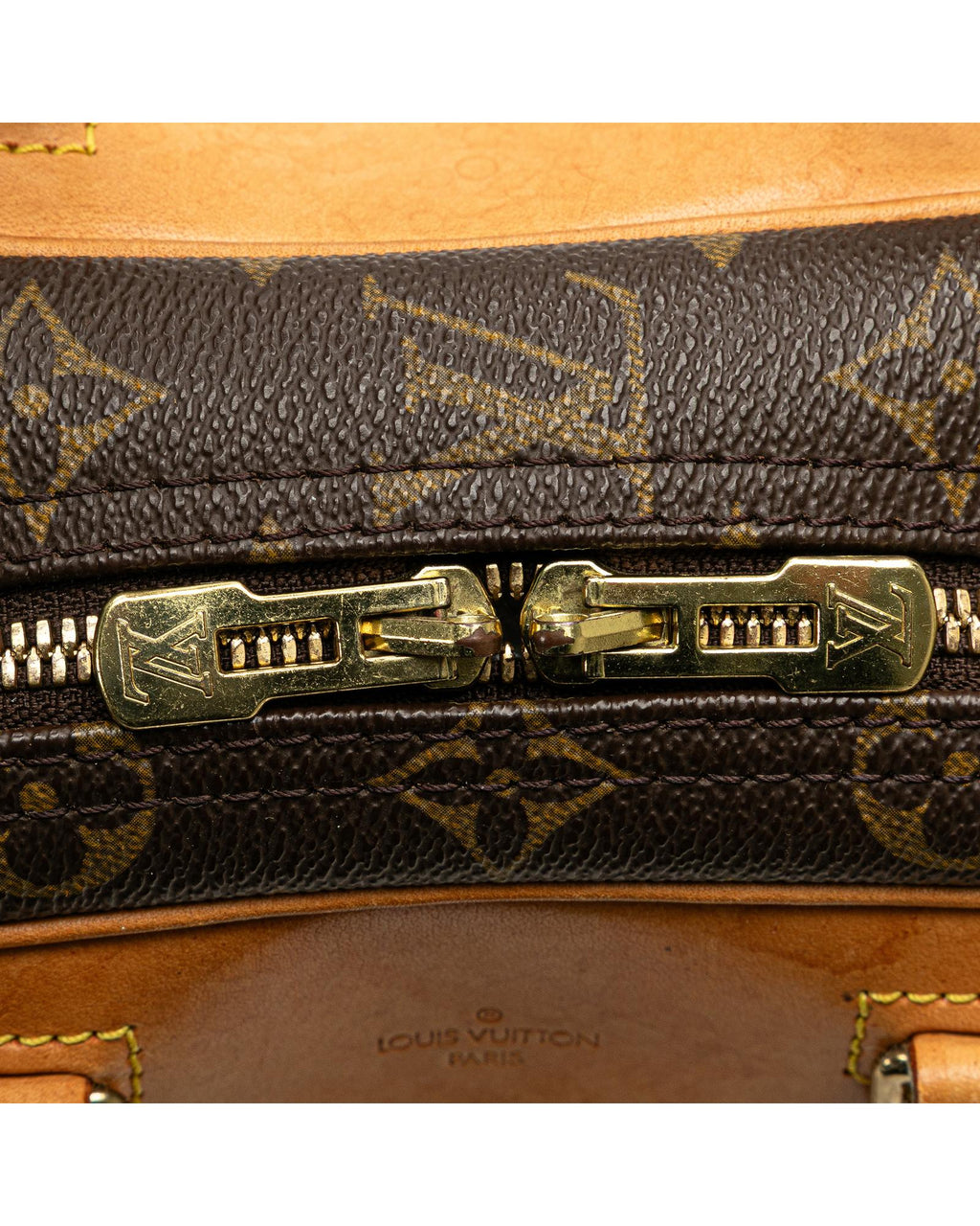 Monogram Canvas Excursion Bag with Vachetta Leather Trim and Zip Closure