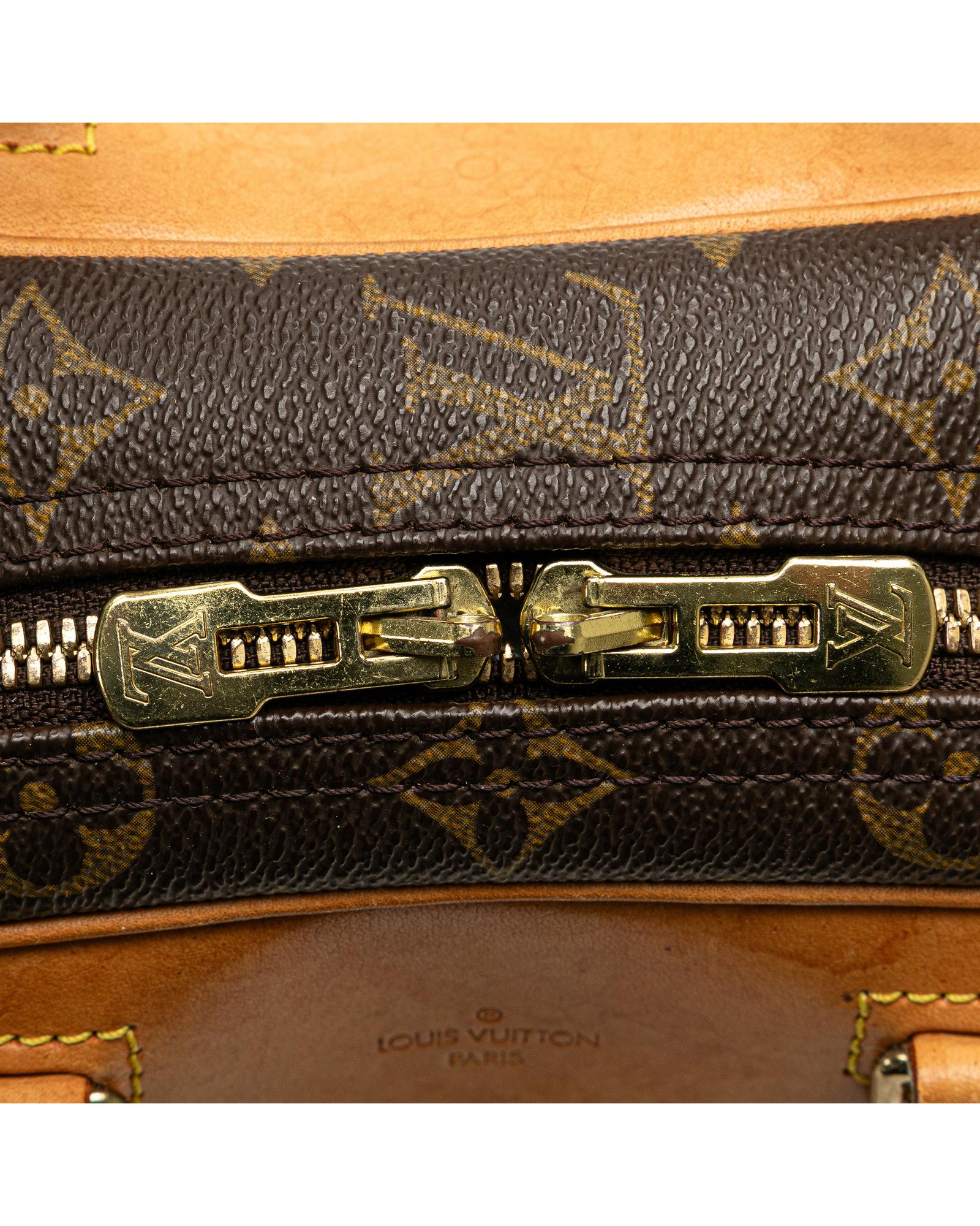Monogram Canvas Excursion Bag with Vachetta Leather Trim and Zip Closure