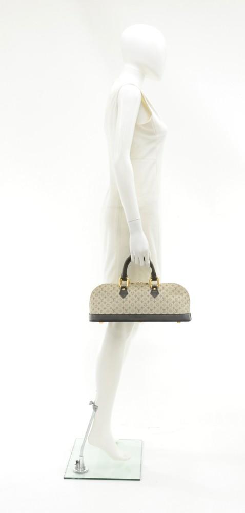 Louis Vuitto Alma Long Mini Lin Canvas Handbag