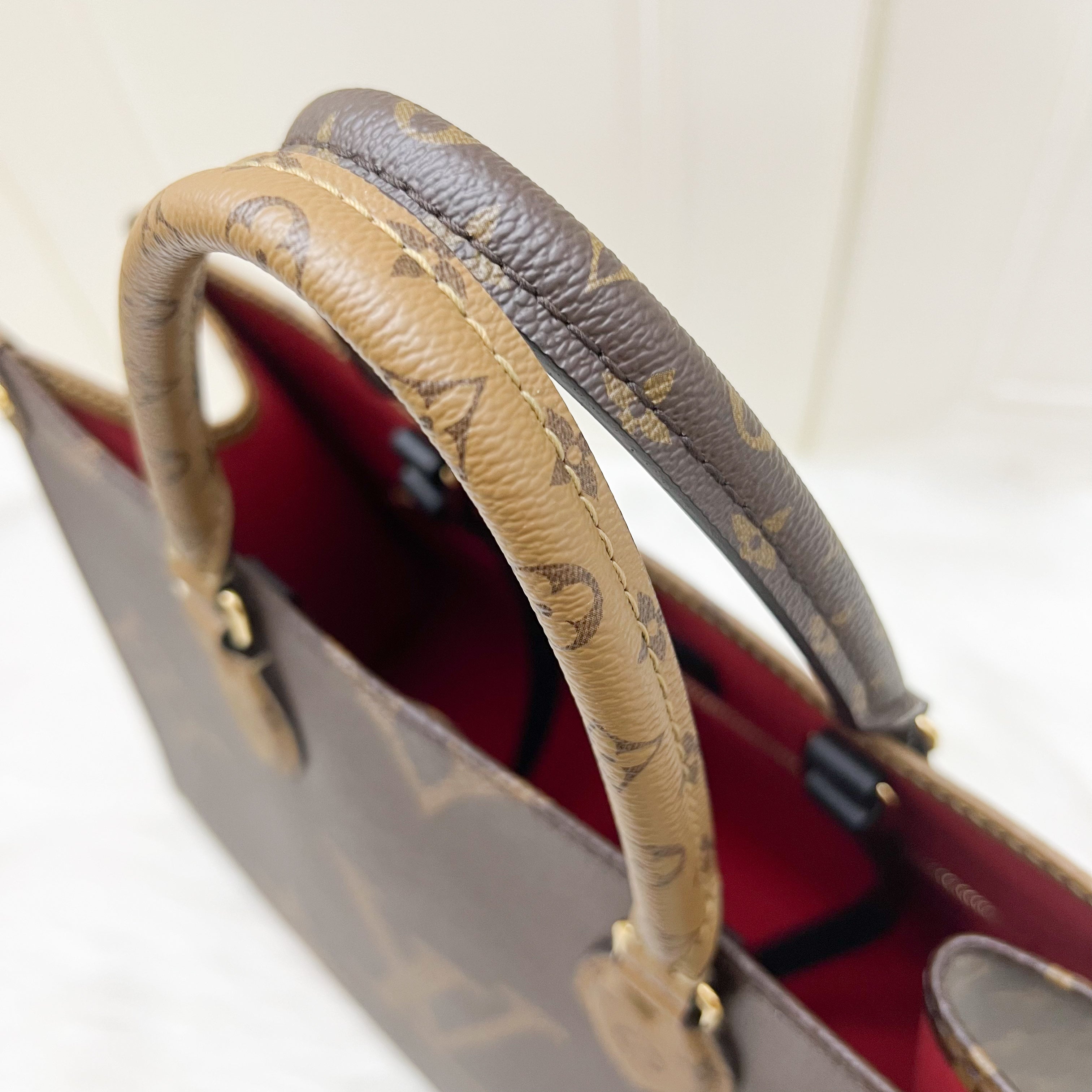 LV Onthego MM in Reverse Giant Monogram Canvas and GHW