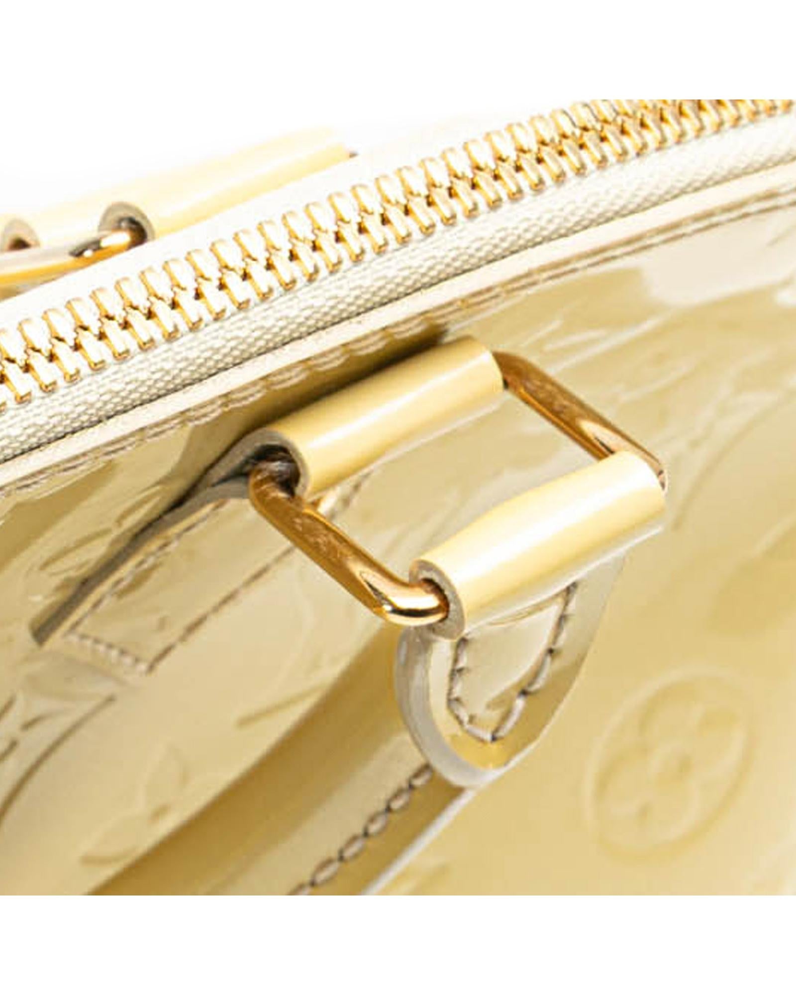 Monogram Vernis Alma PM Handbag with Rolled Handles and Interior Slip Pockets
