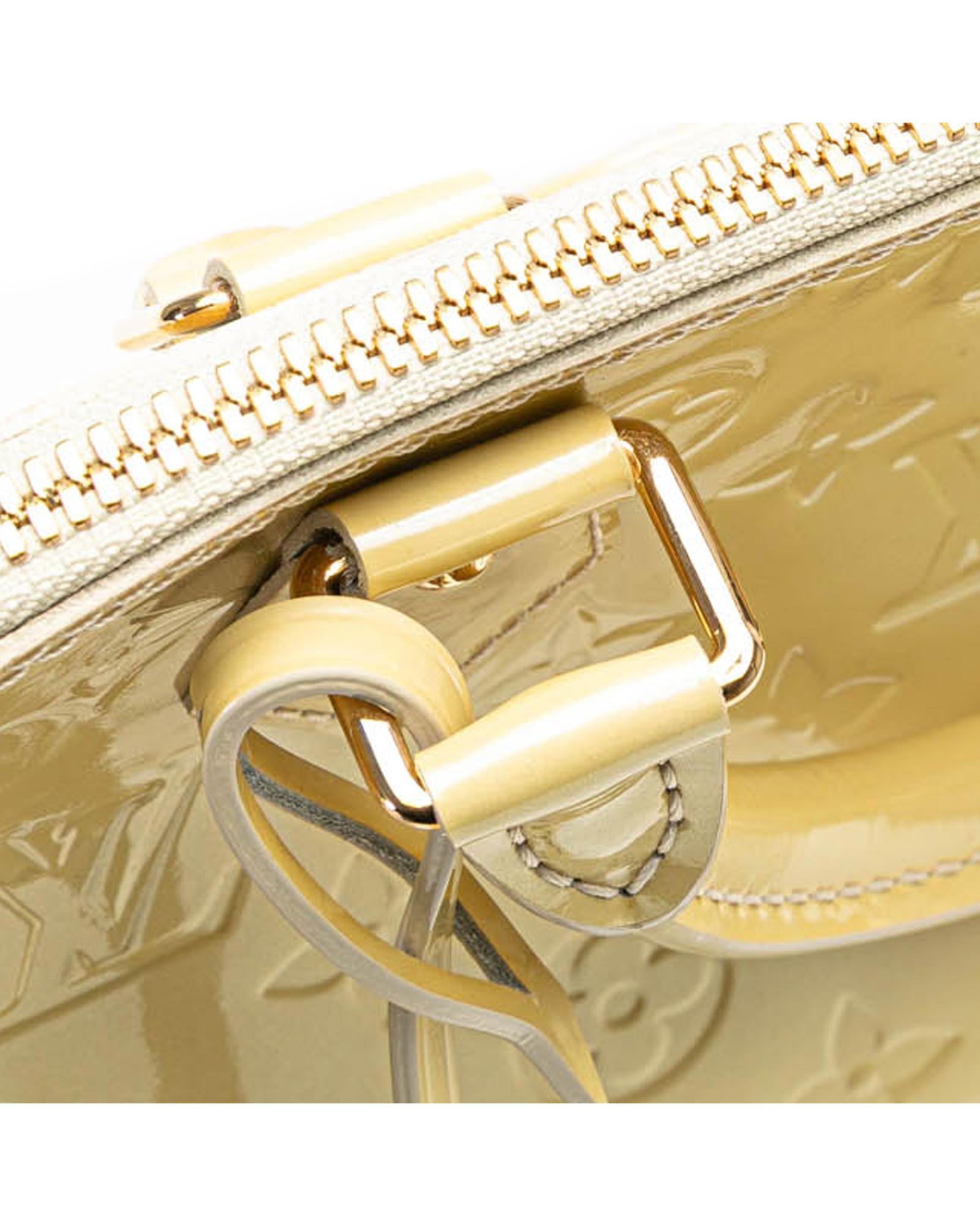 Monogram Vernis Alma PM Handbag with Rolled Handles and Interior Slip Pockets