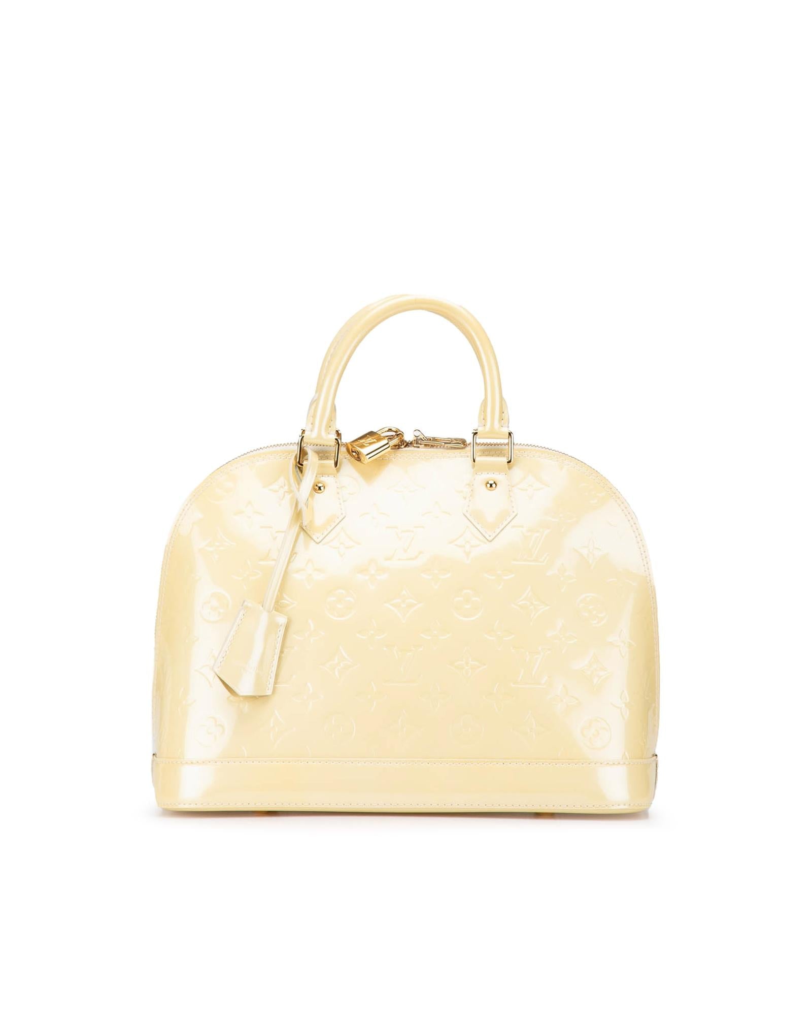 Monogram Vernis Alma PM Handbag with Rolled Handles and Interior Slip Pockets