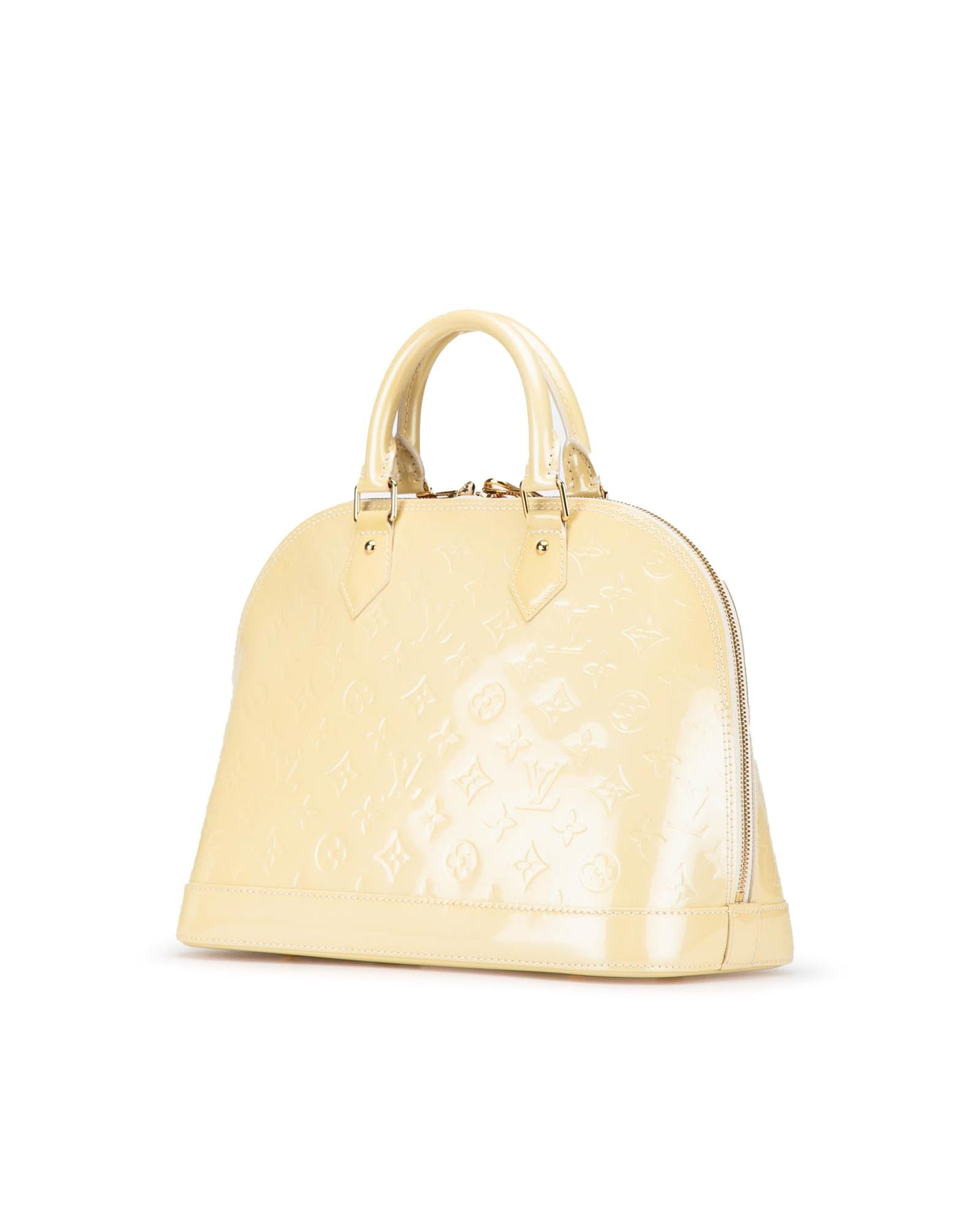 Monogram Vernis Alma PM Handbag with Rolled Handles and Interior Slip Pockets