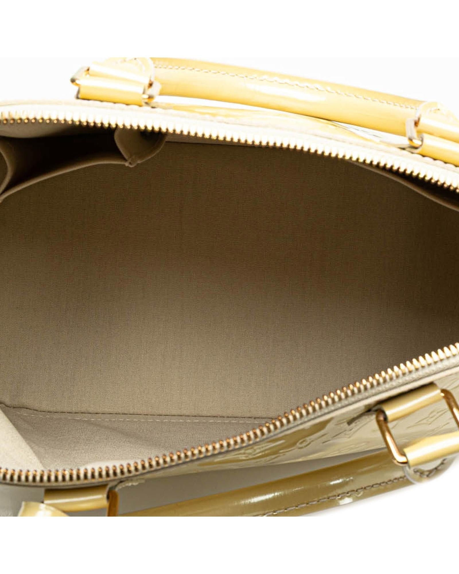 Monogram Vernis Alma PM Handbag with Rolled Handles and Interior Slip Pockets