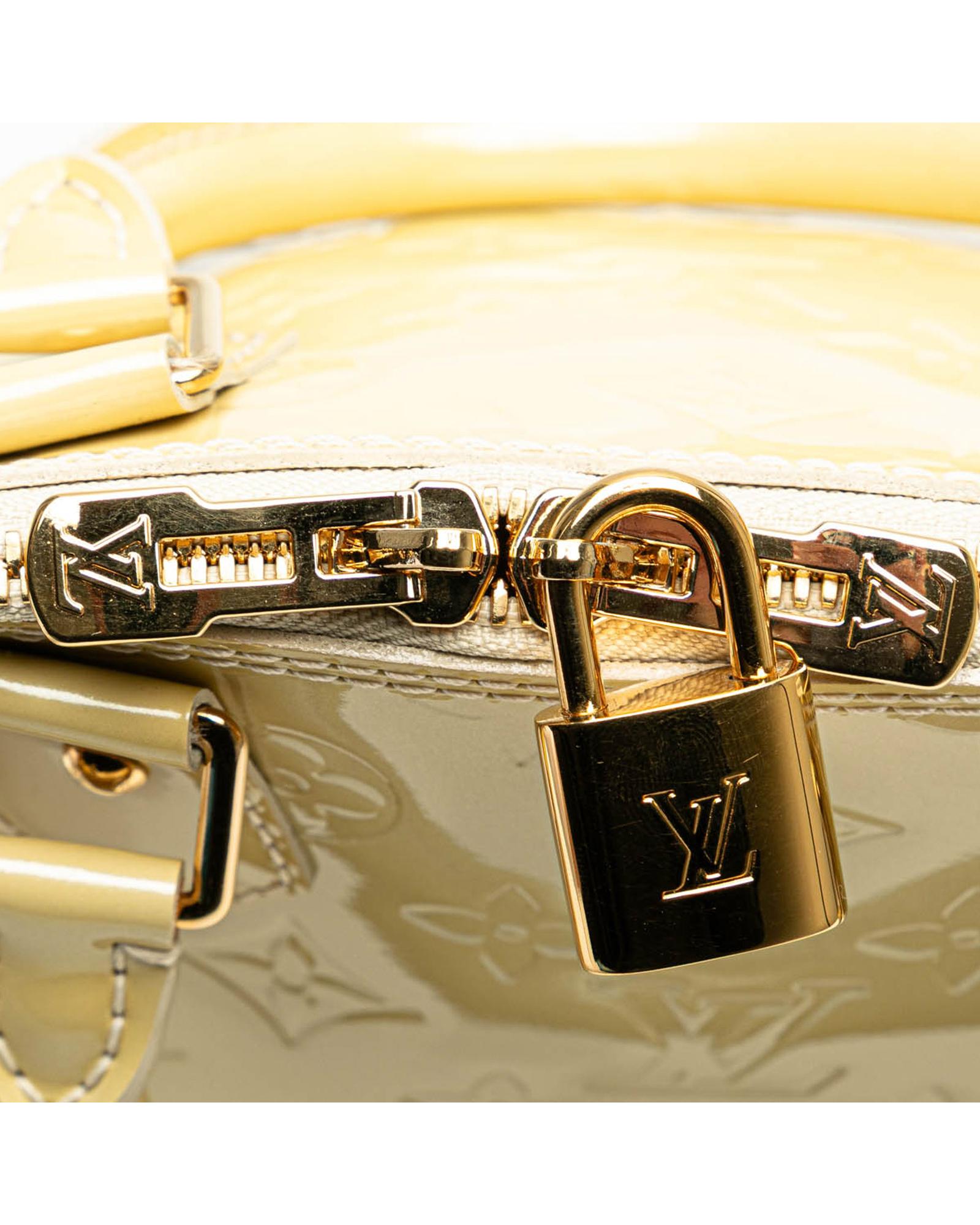 Monogram Vernis Alma PM Handbag with Rolled Handles and Interior Slip Pockets