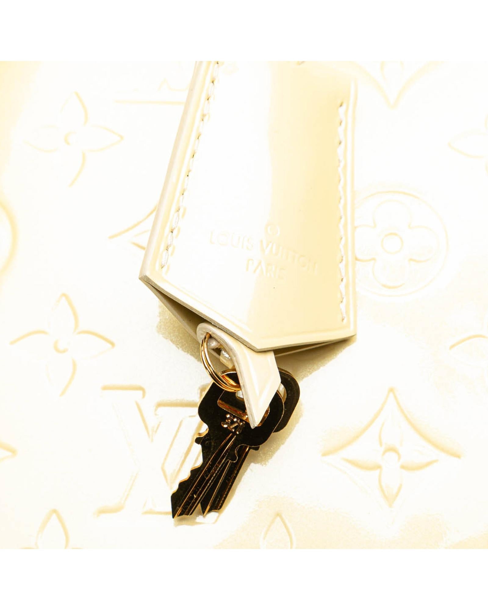 Monogram Vernis Alma PM Handbag with Rolled Handles and Interior Slip Pockets