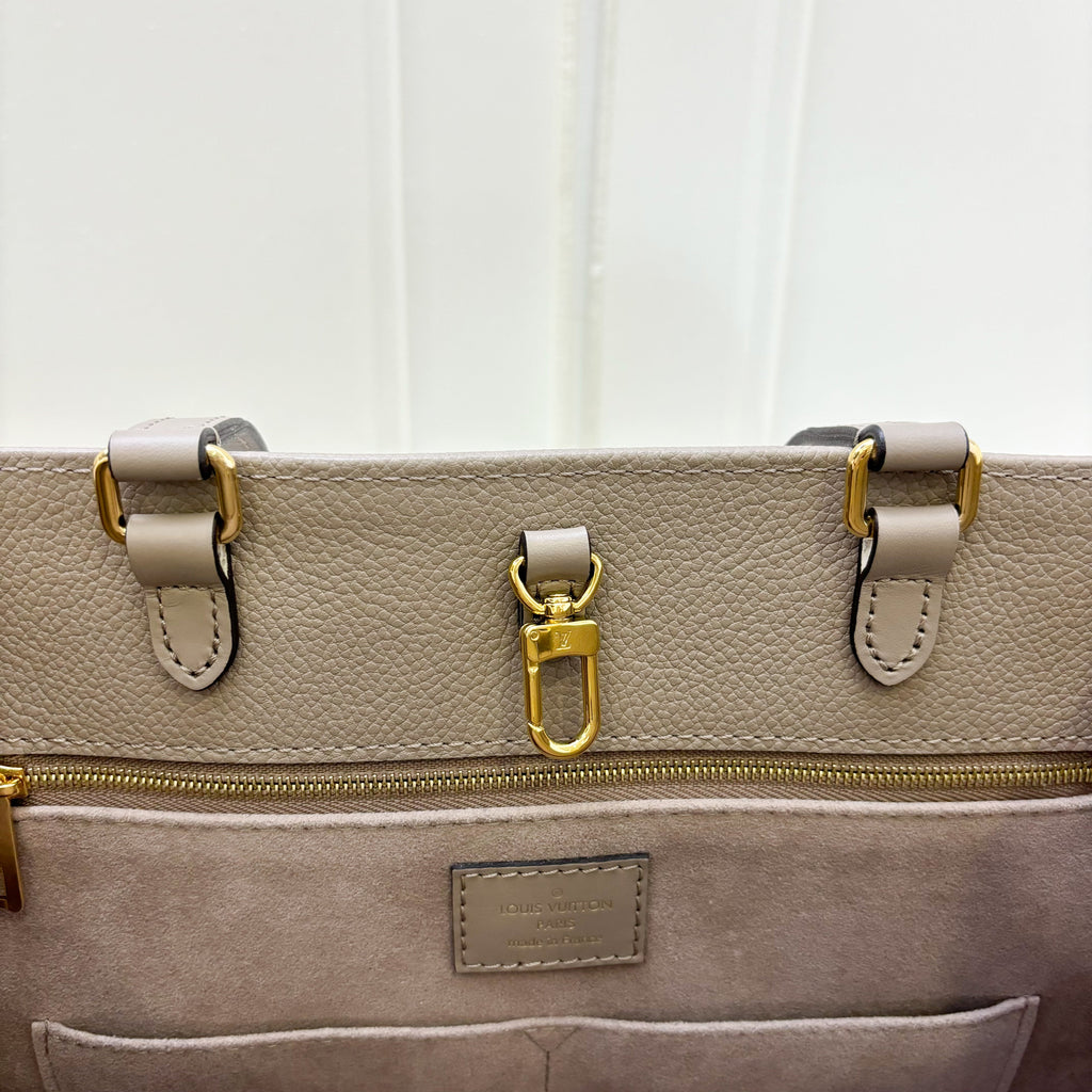 LV Onthego MM in Tourterelle Empreinte Leather and GHW