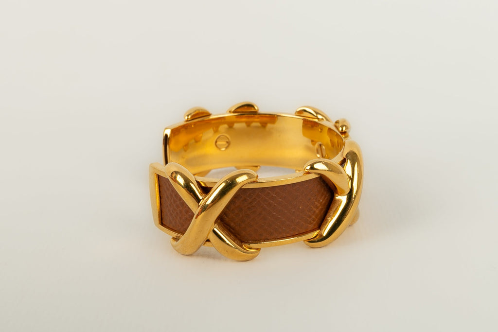 Bracelet en mÃƒÆ’Ã‚Â©tal dorÃƒÆ’Ã‚Â© et cuir HermÃƒÆ’Ã‚Â¨s