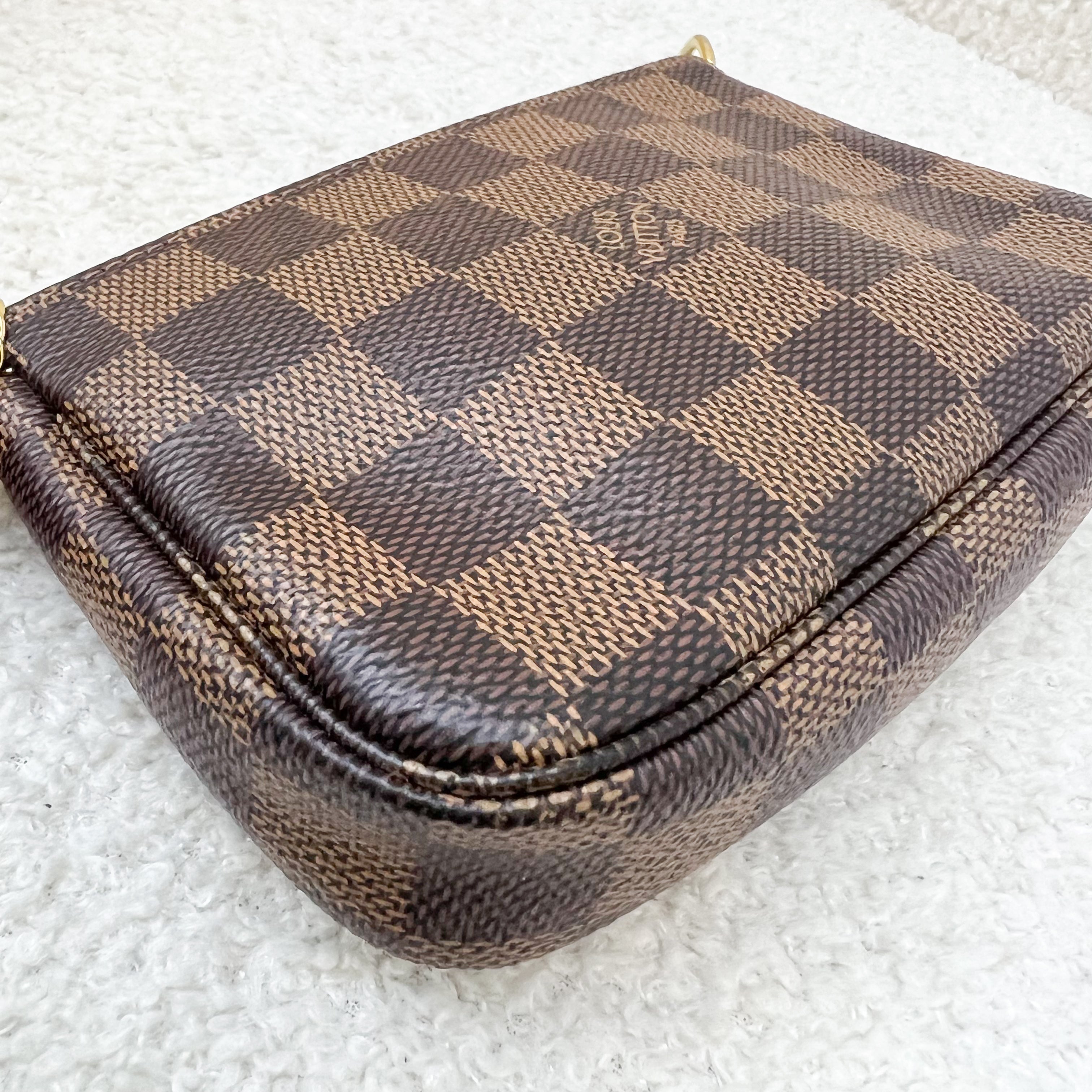 LV Mini Pochette Accessoires in Damier Ebene Canvas GHW