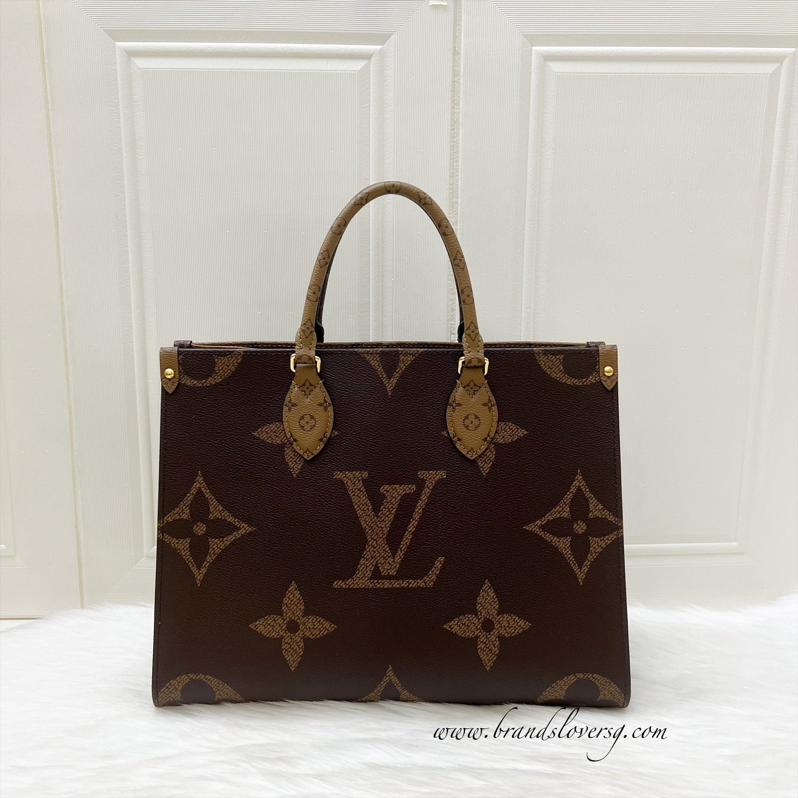 LV Onthego MM in Reverse Giant Monogram Canvas and GHW