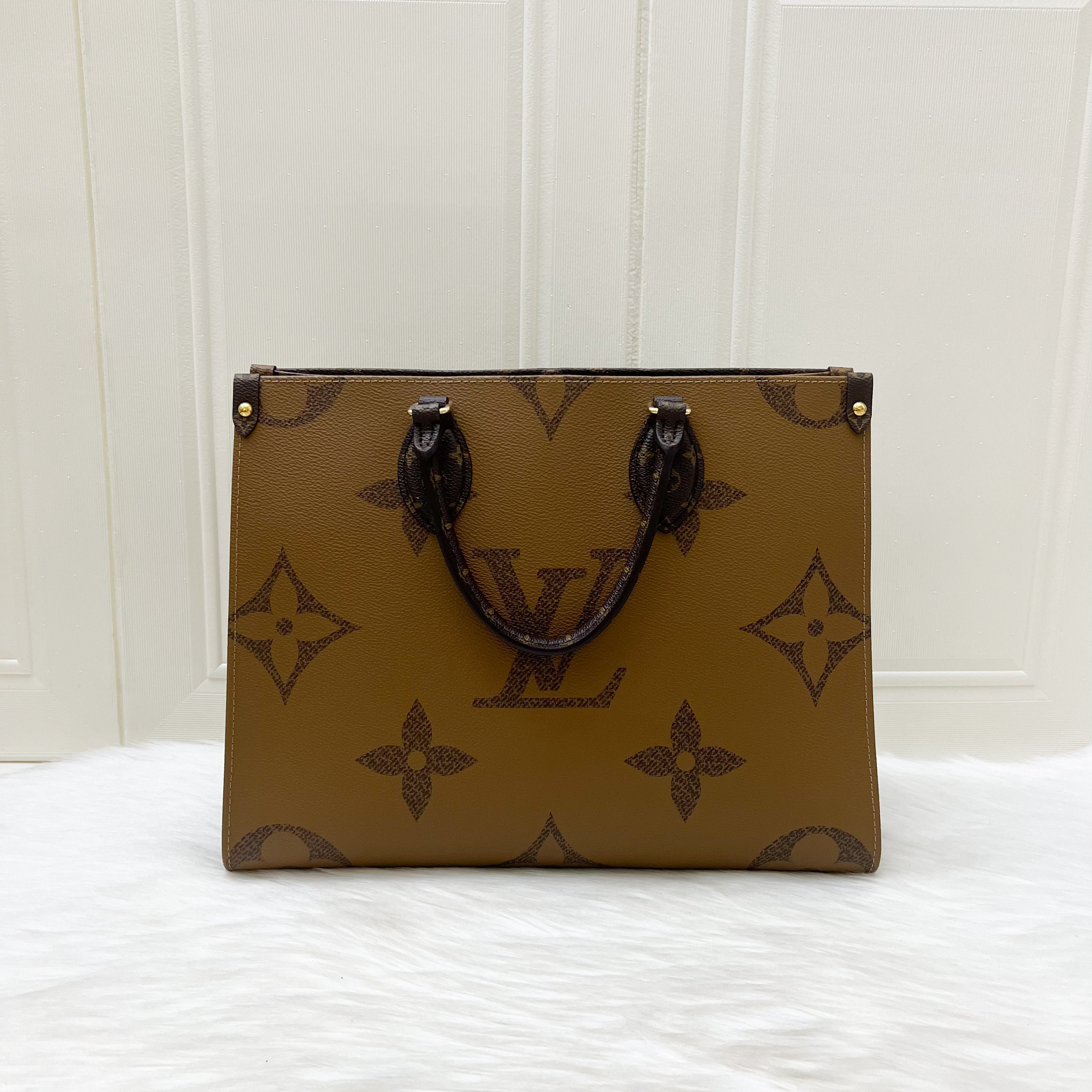 LV Onthego MM in Reverse Giant Monogram Canvas and GHW