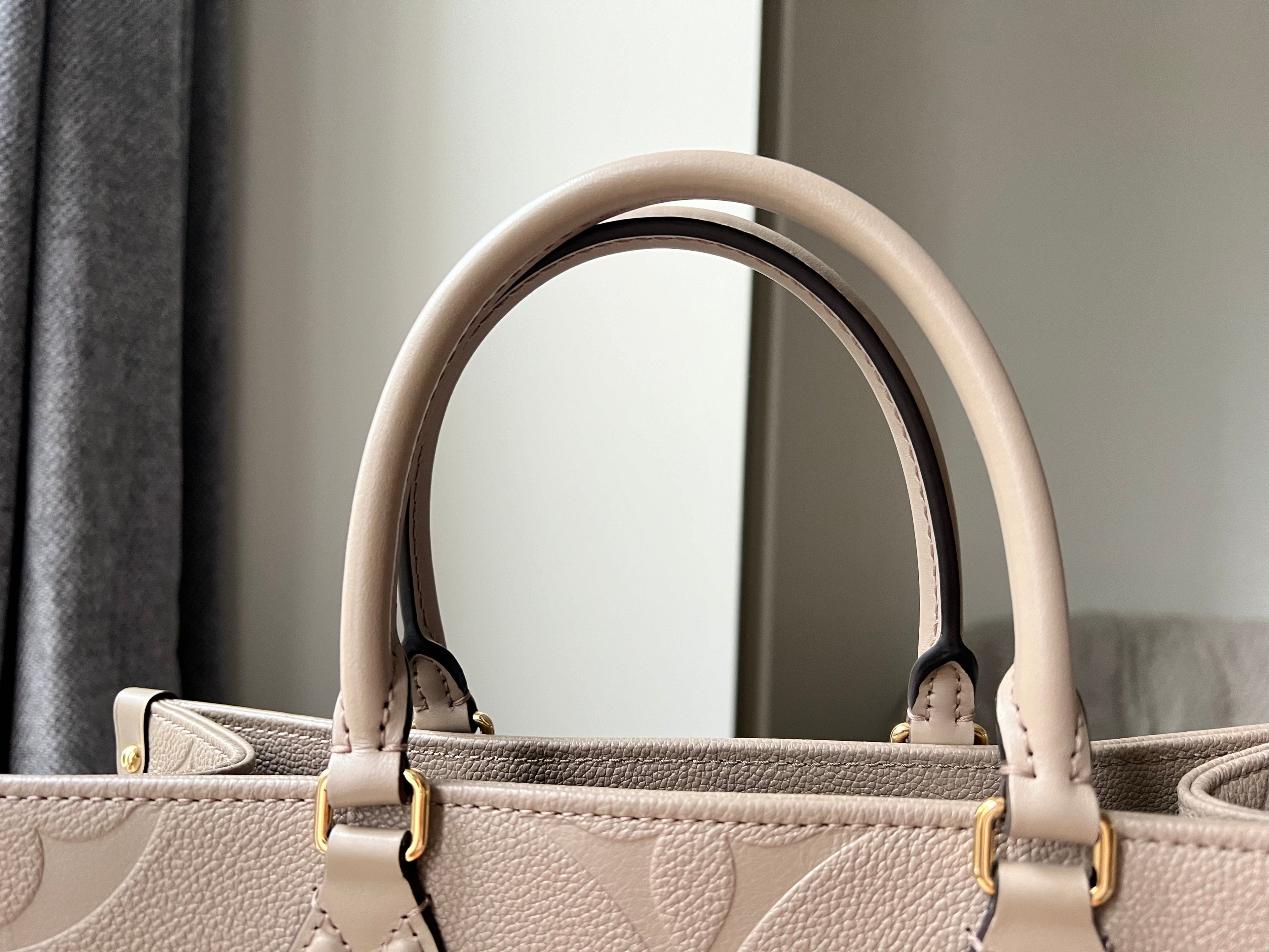 Louis Vuitton On the Go MM Dune Empreinte (RRP £2,480)