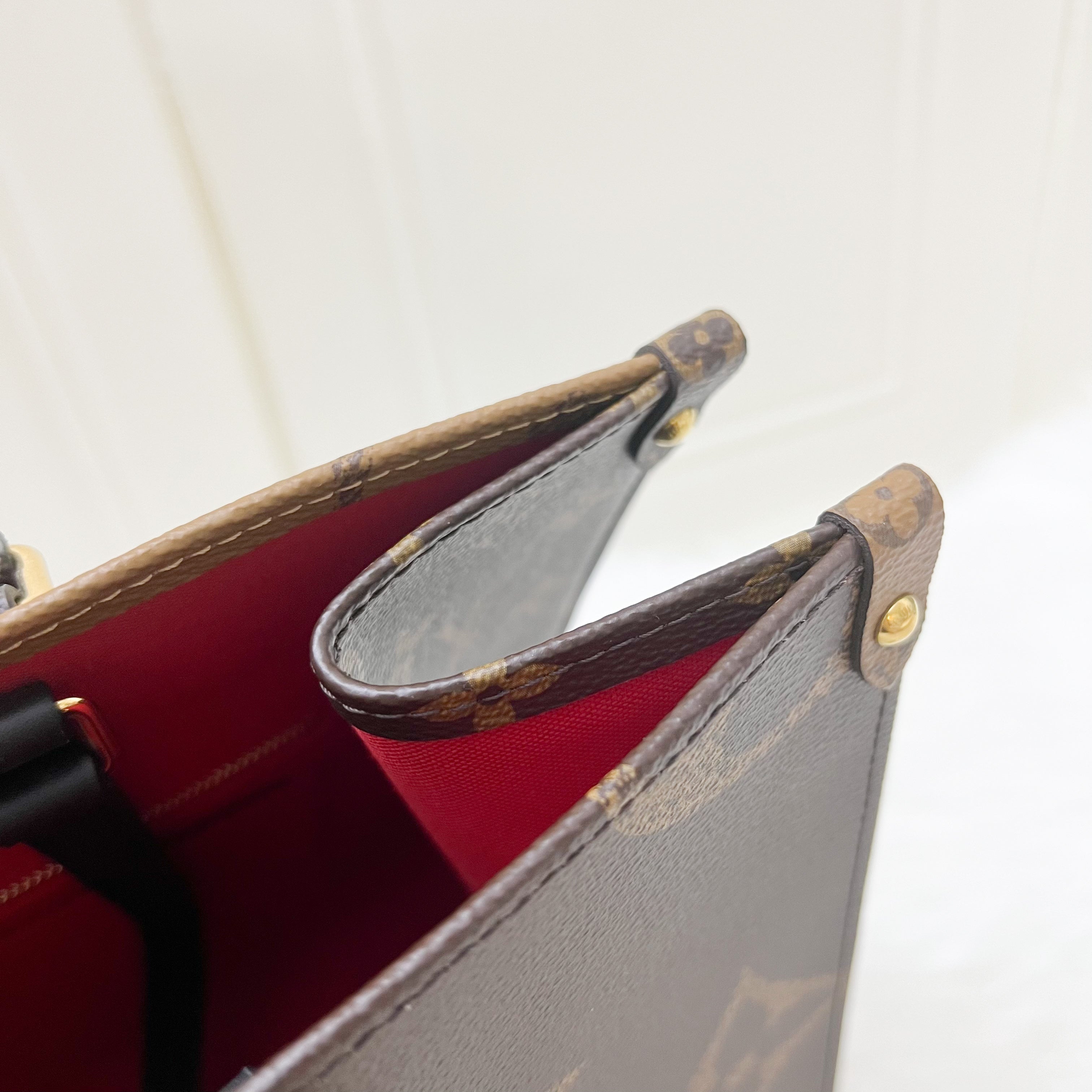 LV Onthego MM in Reverse Giant Monogram Canvas and GHW