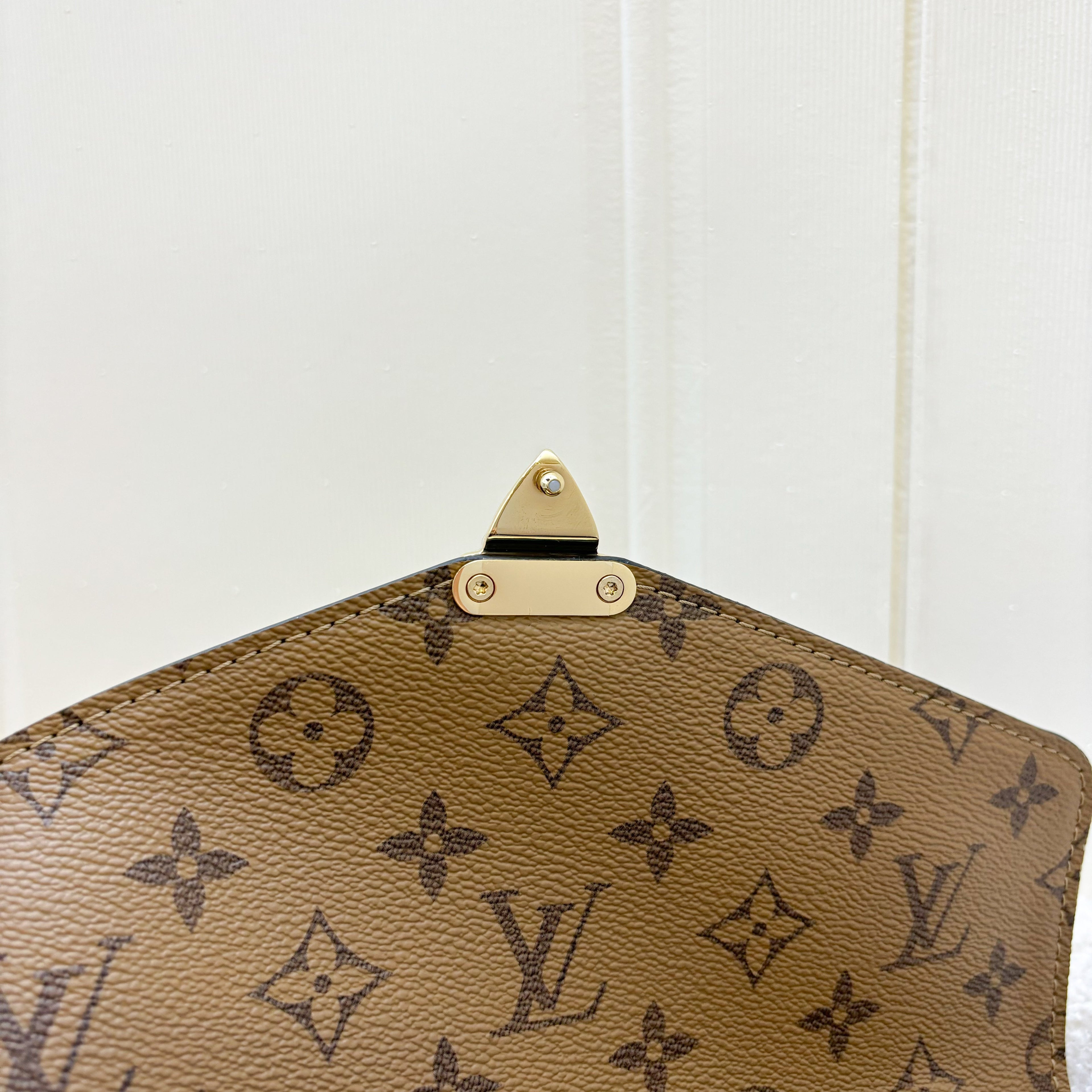 LV Pochette Metis in Reverse Monogram Canvas, Black Leather and GHW