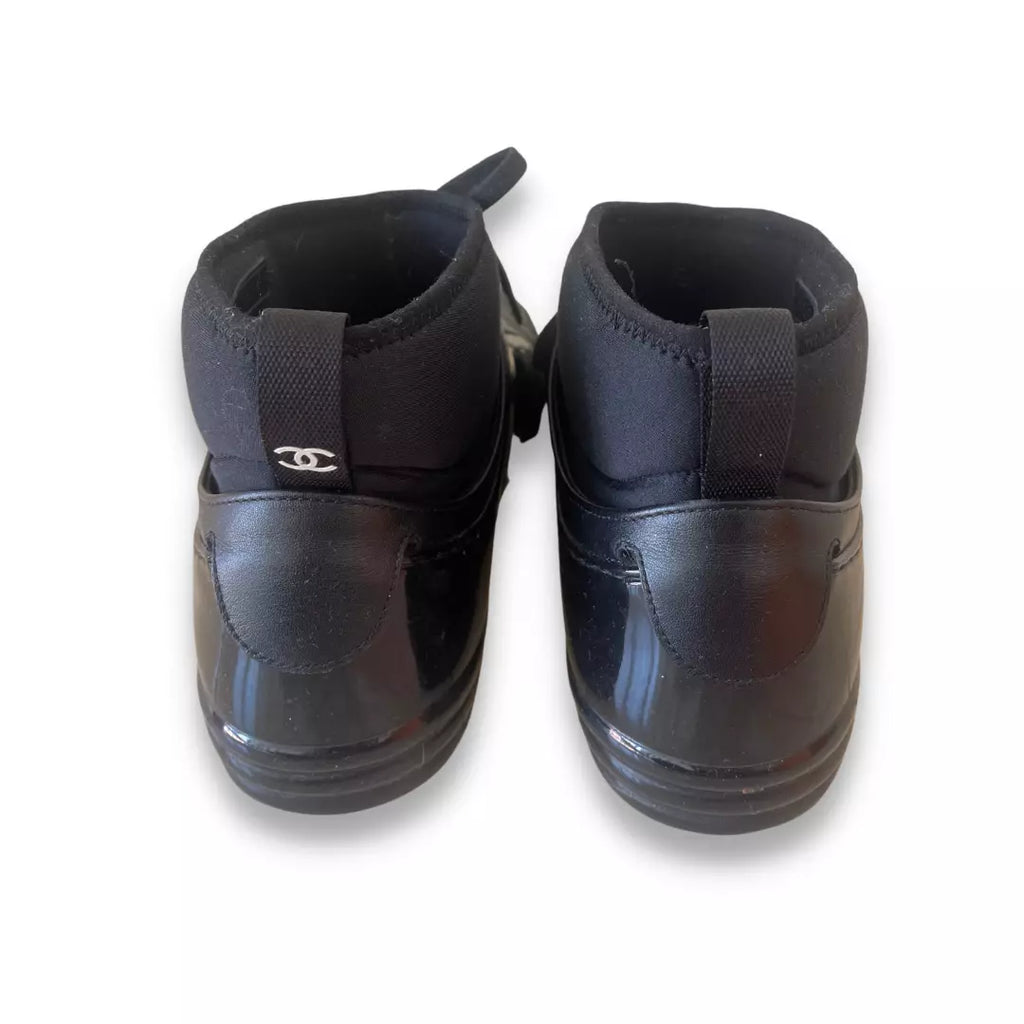 CHANEL BLACK RUBBER AND LEATHER CC SNEAKERS
