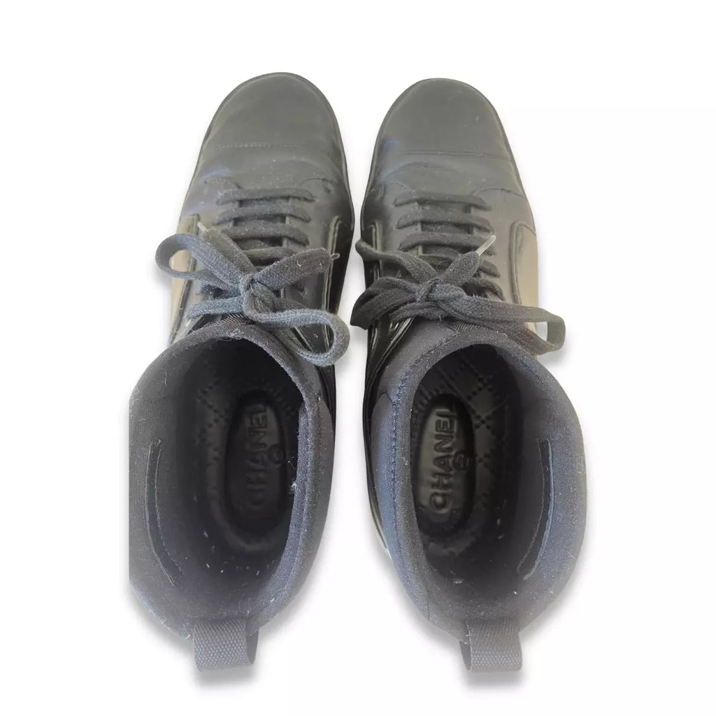 CHANEL BLACK RUBBER AND LEATHER CC SNEAKERS