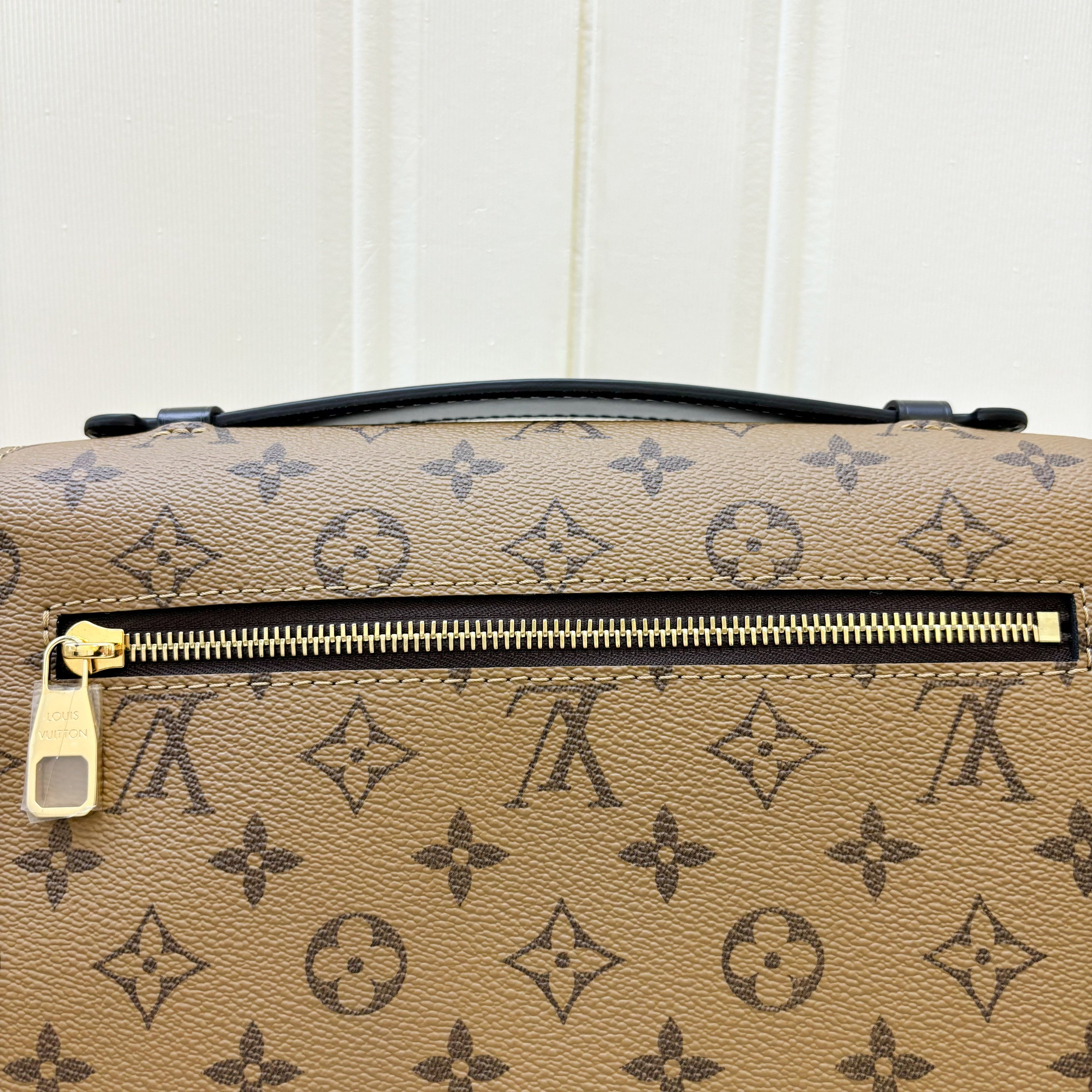 LV Pochette Metis in Reverse Monogram Canvas, Black Leather and GHW