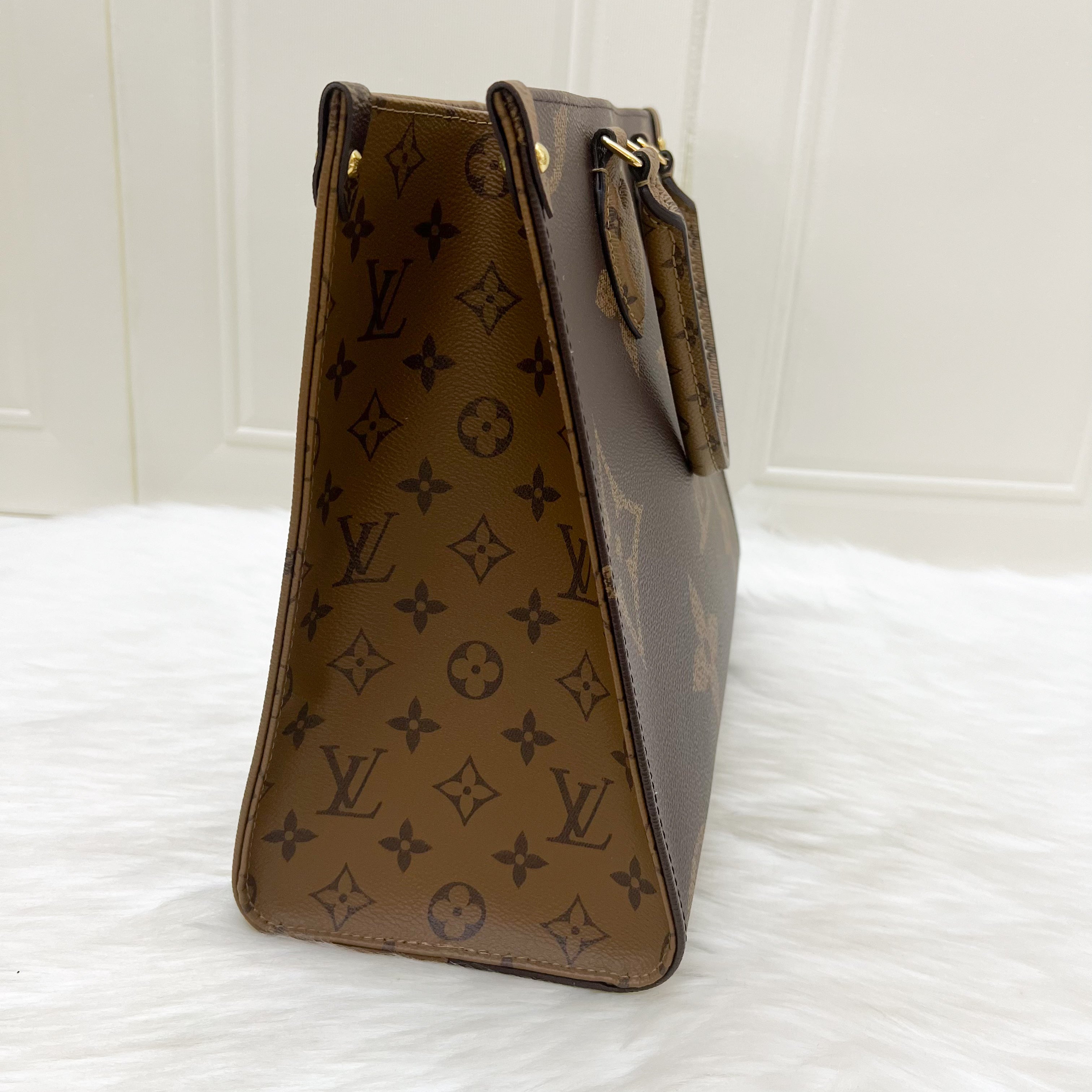 LV Onthego MM in Reverse Giant Monogram Canvas and GHW