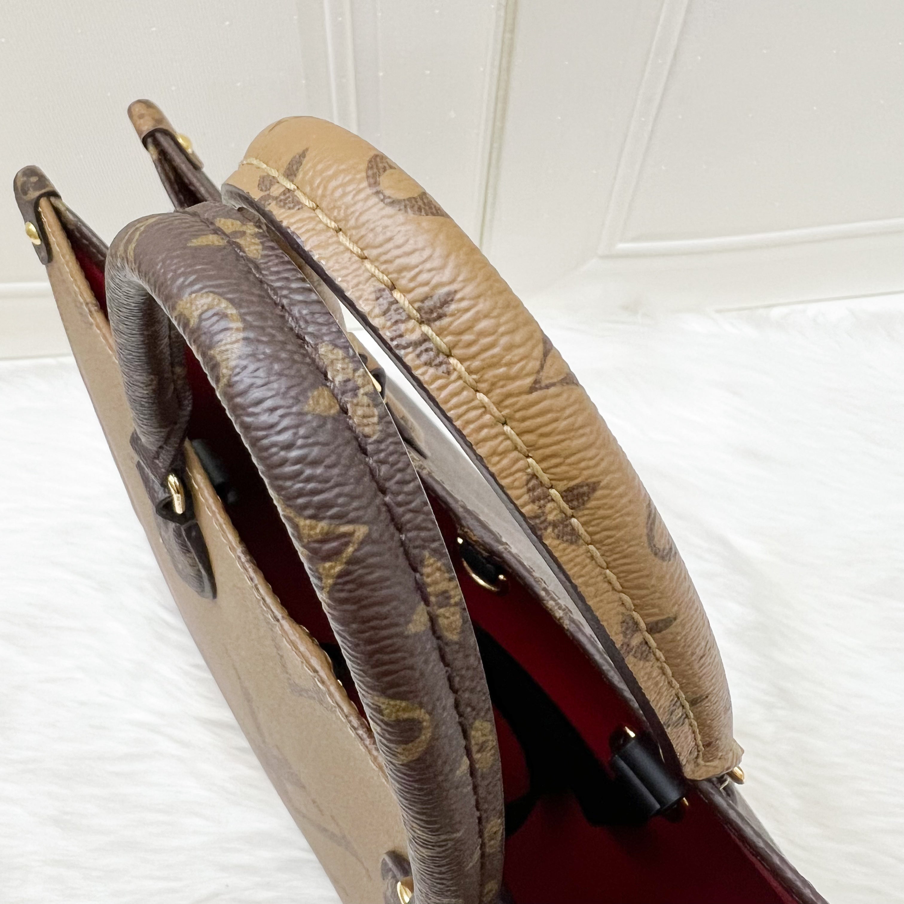 LV Onthego MM in Reverse Giant Monogram Canvas and GHW