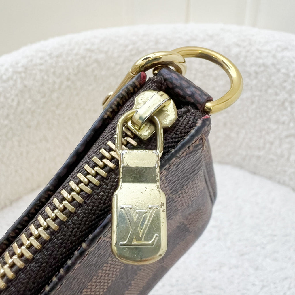 LV Mini Pochette Accessoires in Damier Ebene Canvas GHW