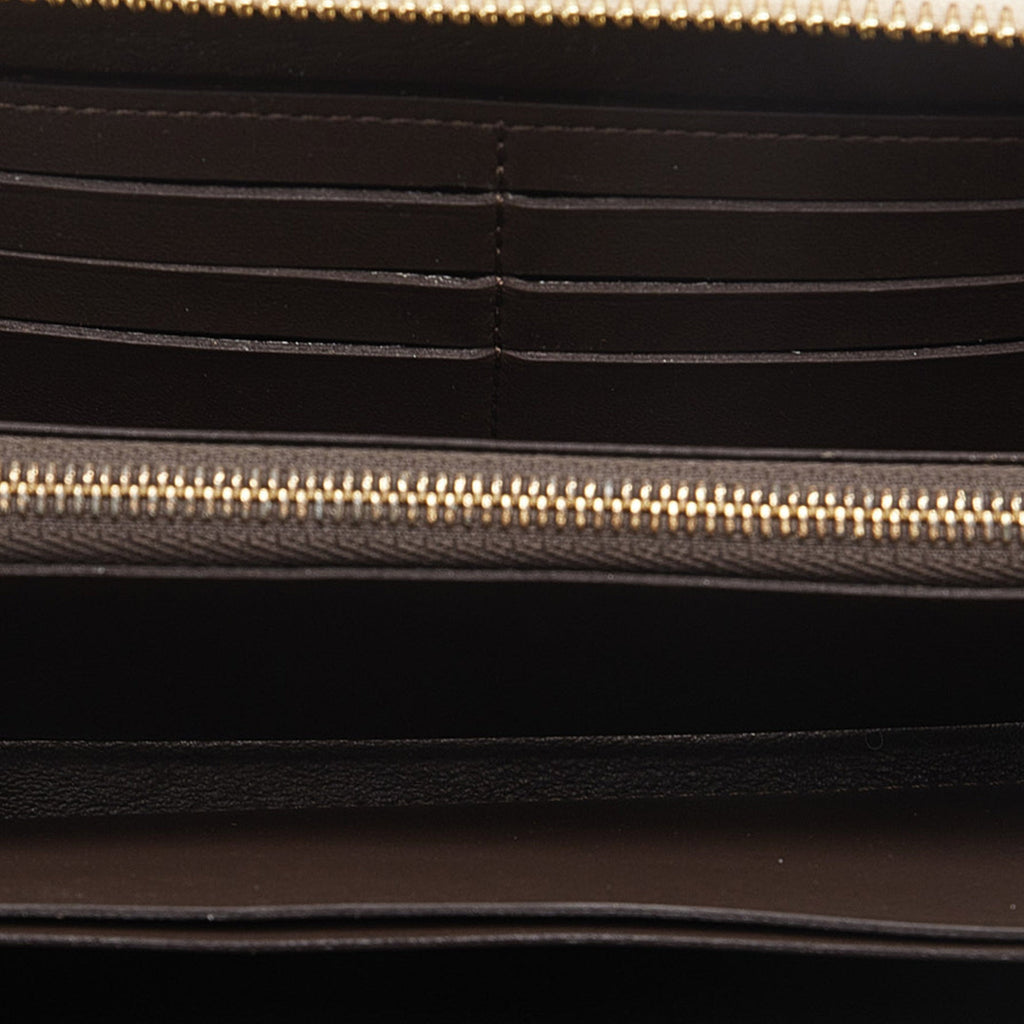 Brown Louis Vuitton Taurillon Comete Wallet