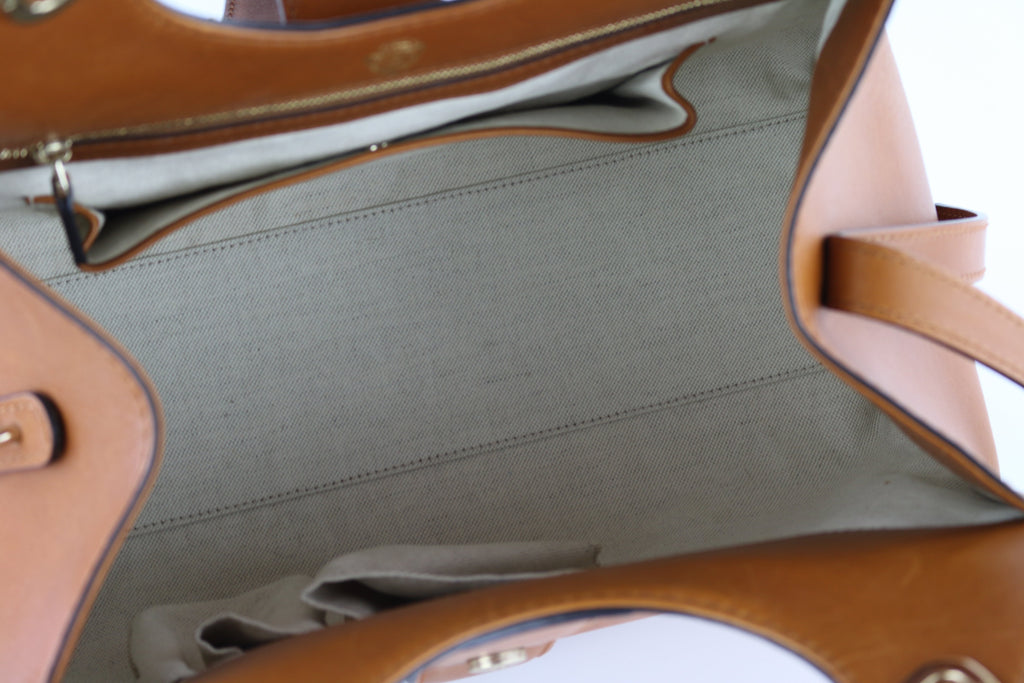 Brown Top Handle Stirrup Bag