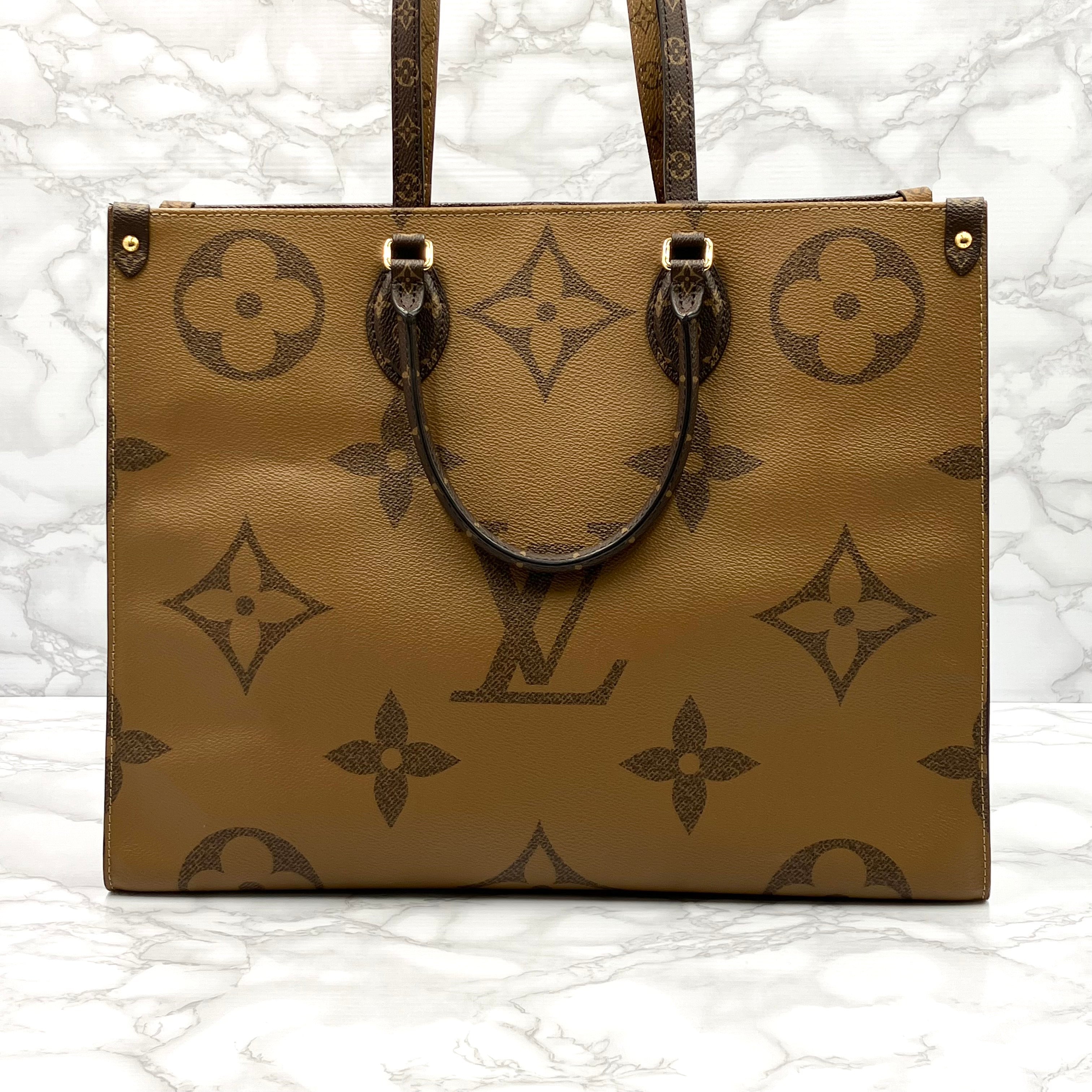 LOUIS VUITTON On The Go GM Monogram Giant Reverse