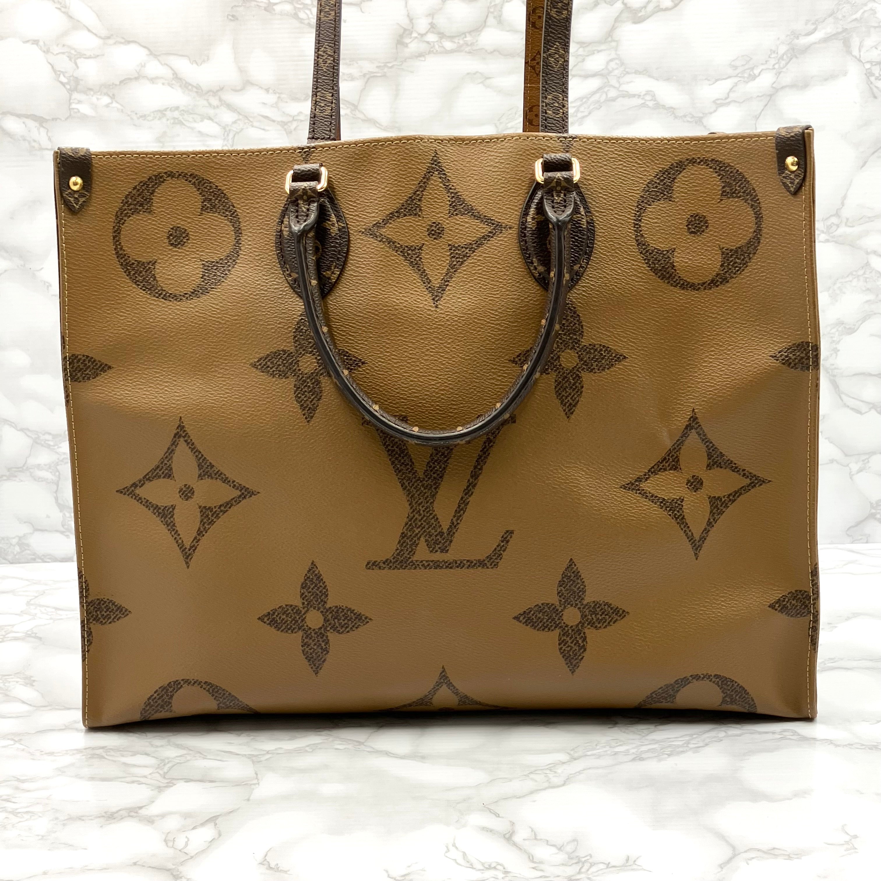 LOUIS VUITTON On The Go GM Monogram Giant Reverse