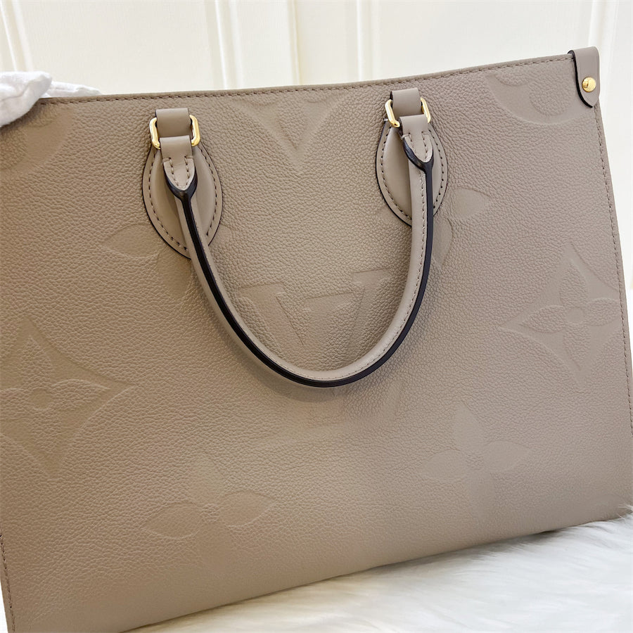 LV Onthego MM in Tourterelle Empreinte Leather and GHW