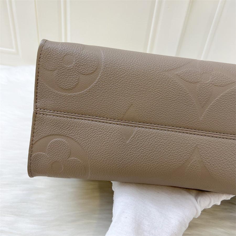 LV Onthego MM in Tourterelle Empreinte Leather and GHW