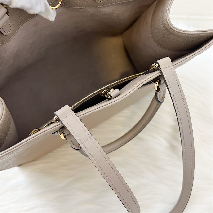 LV Onthego MM in Tourterelle Empreinte Leather and GHW