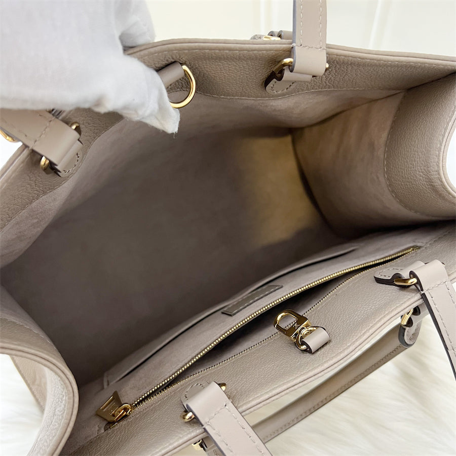 LV Onthego MM in Tourterelle Empreinte Leather and GHW
