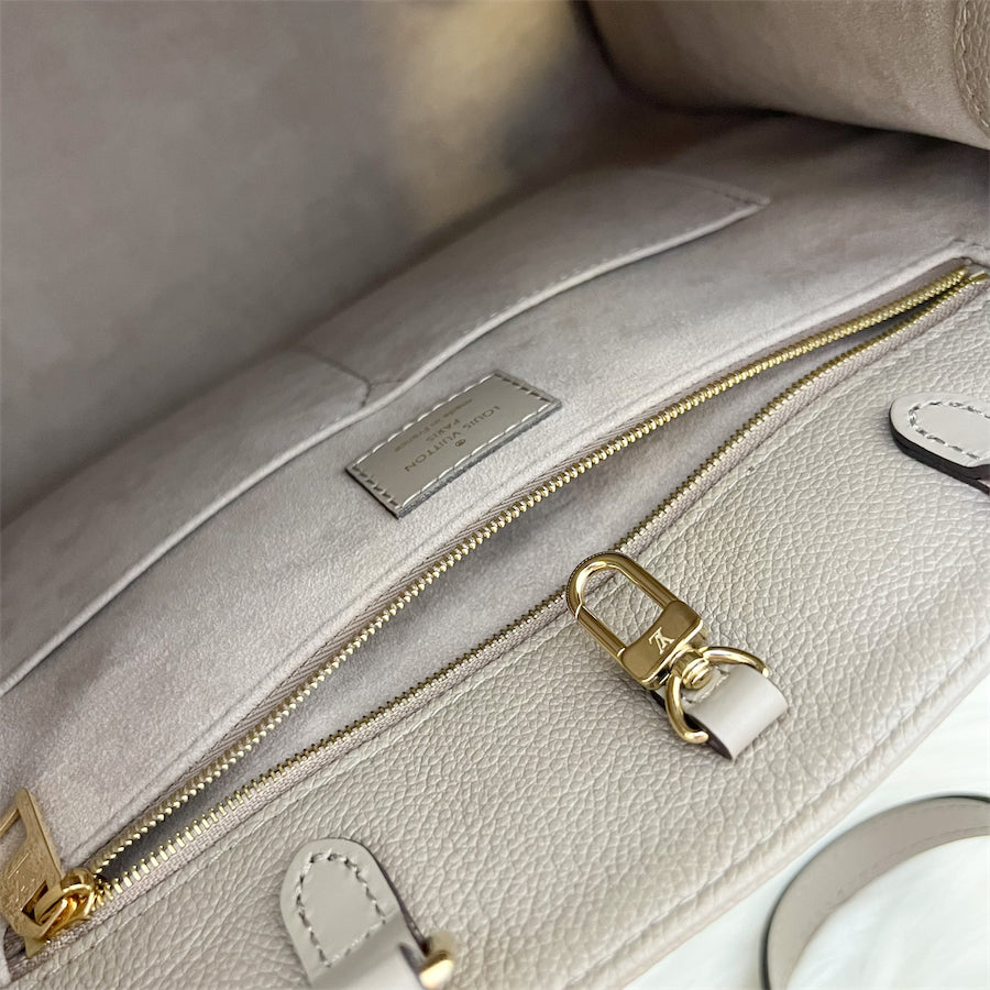 LV Onthego MM in Tourterelle Empreinte Leather and GHW