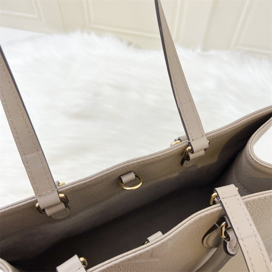 LV Onthego MM in Tourterelle Empreinte Leather and GHW