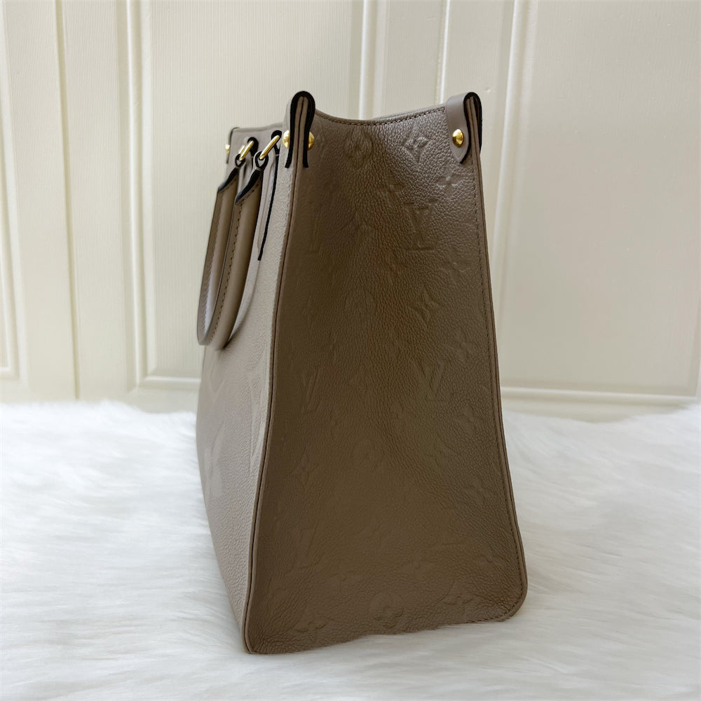 LV Onthego MM in Tourterelle Giant Monogram Empreinte Leather GHW