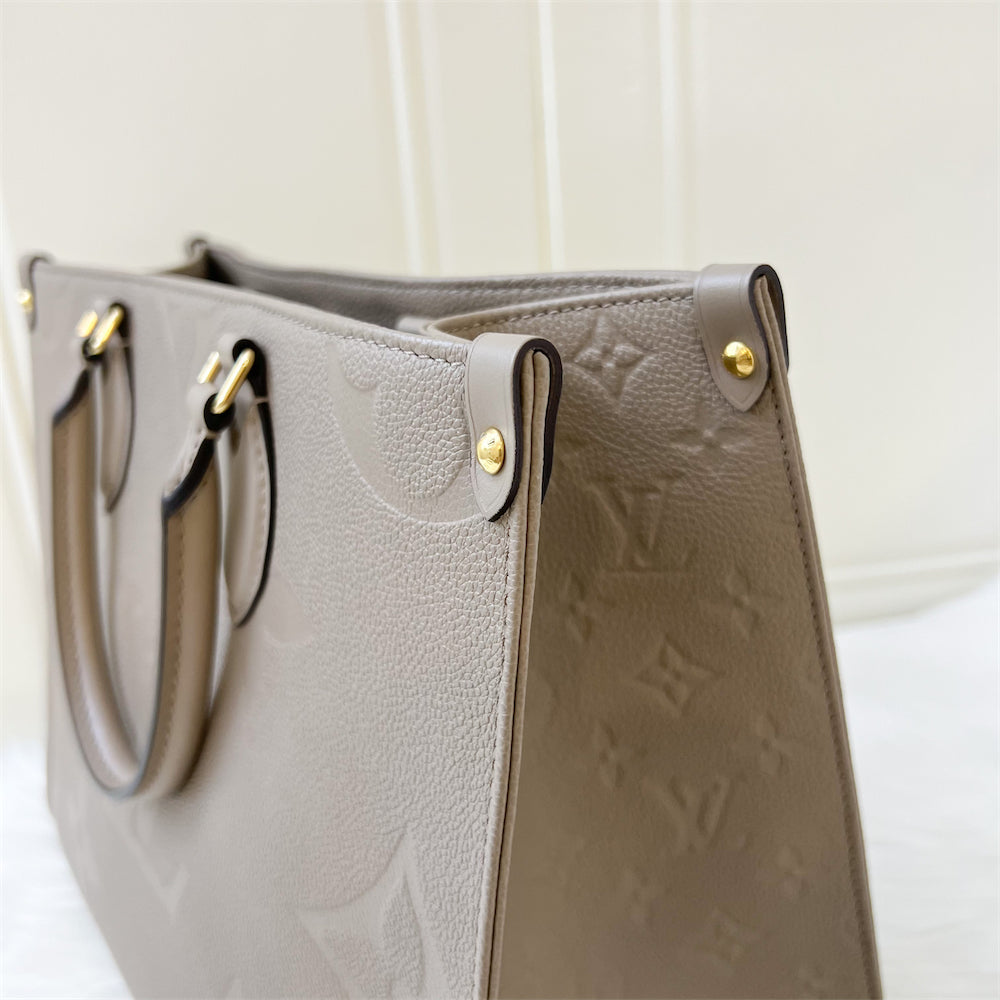 LV Onthego MM in Tourterelle Giant Monogram Empreinte Leather GHW
