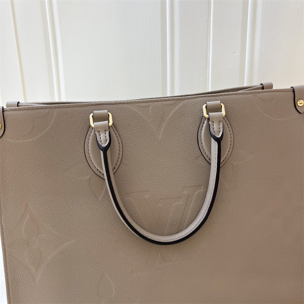 LV Onthego MM in Tourterelle Giant Monogram Empreinte Leather GHW