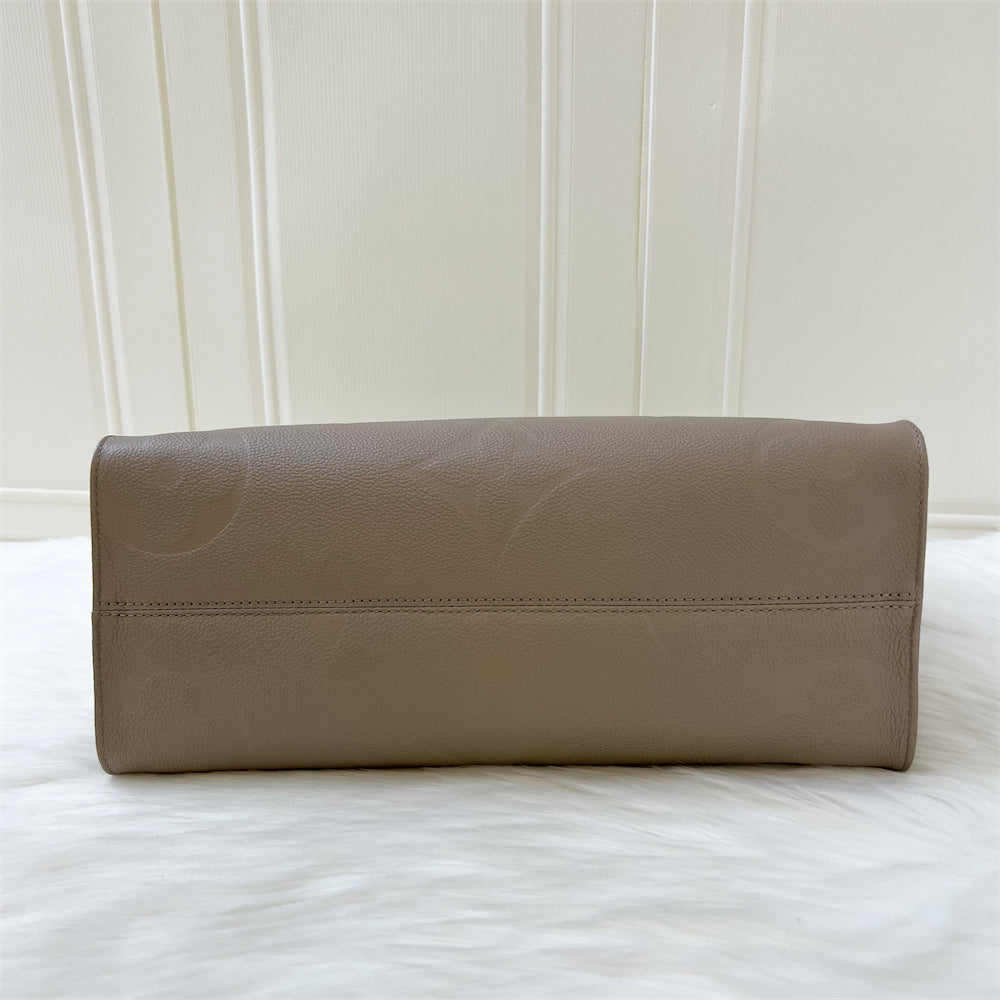 LV Onthego MM in Tourterelle Giant Monogram Empreinte Leather GHW