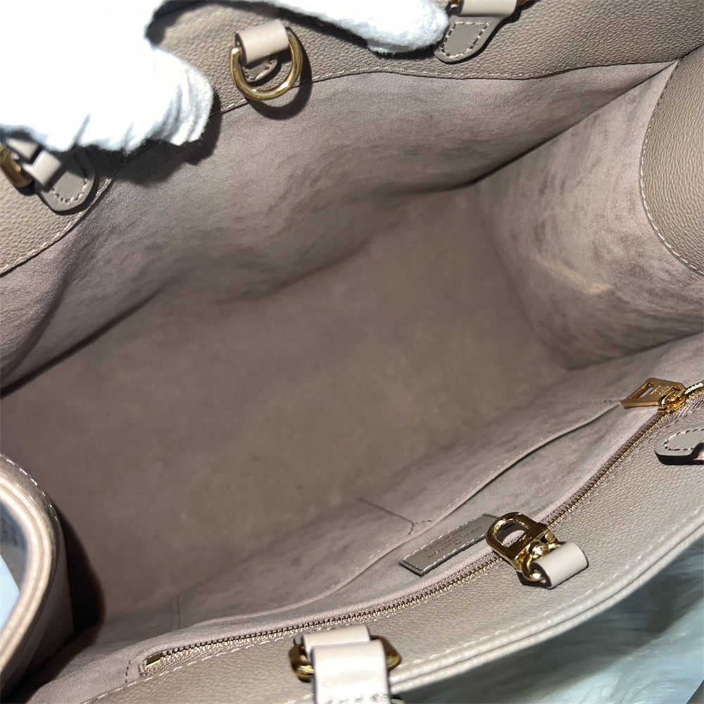 LV Onthego MM in Tourterelle Giant Monogram Empreinte Leather GHW