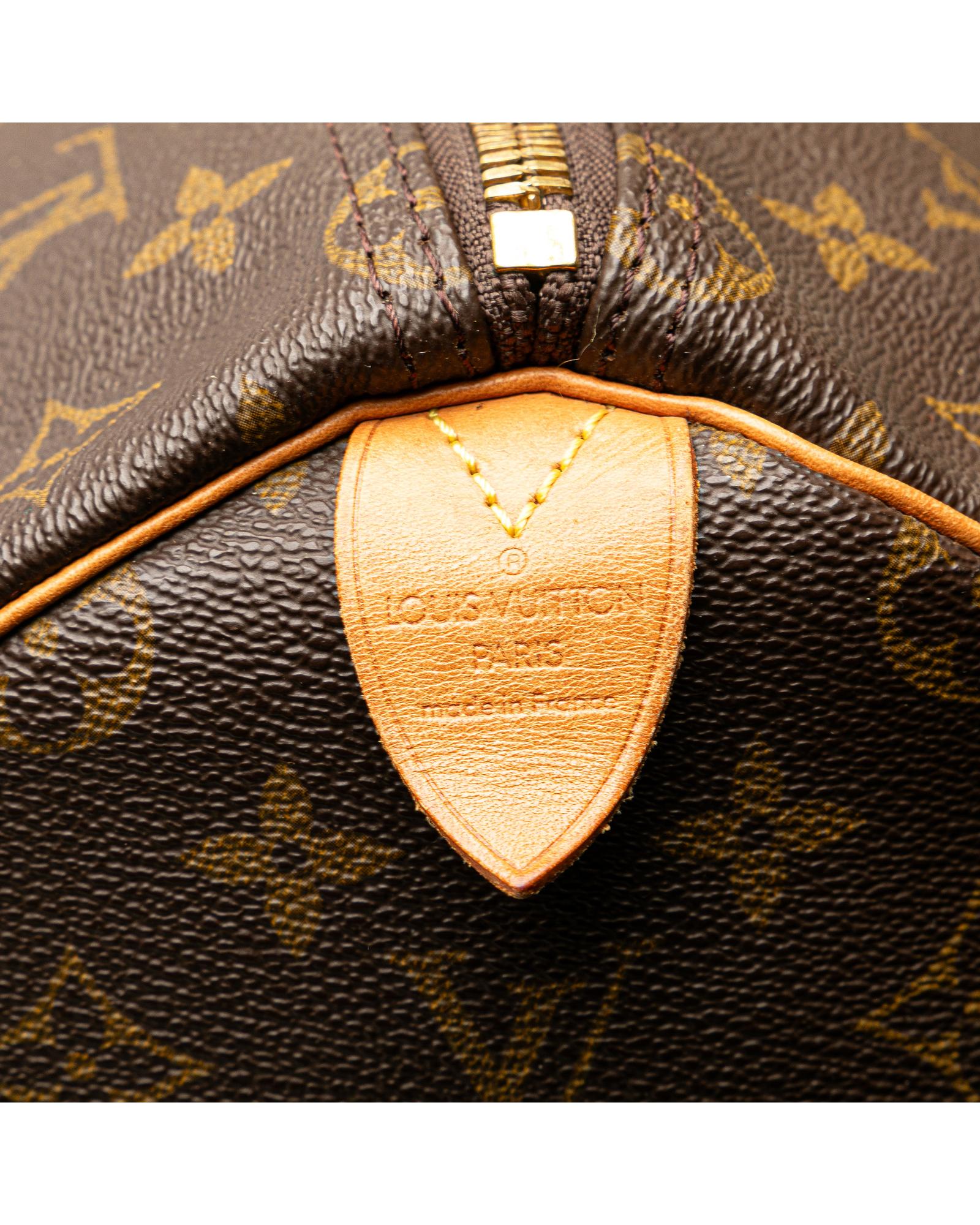 Monogram Canvas Keepall with Vachetta Leather Trim and Top Zip Closure
