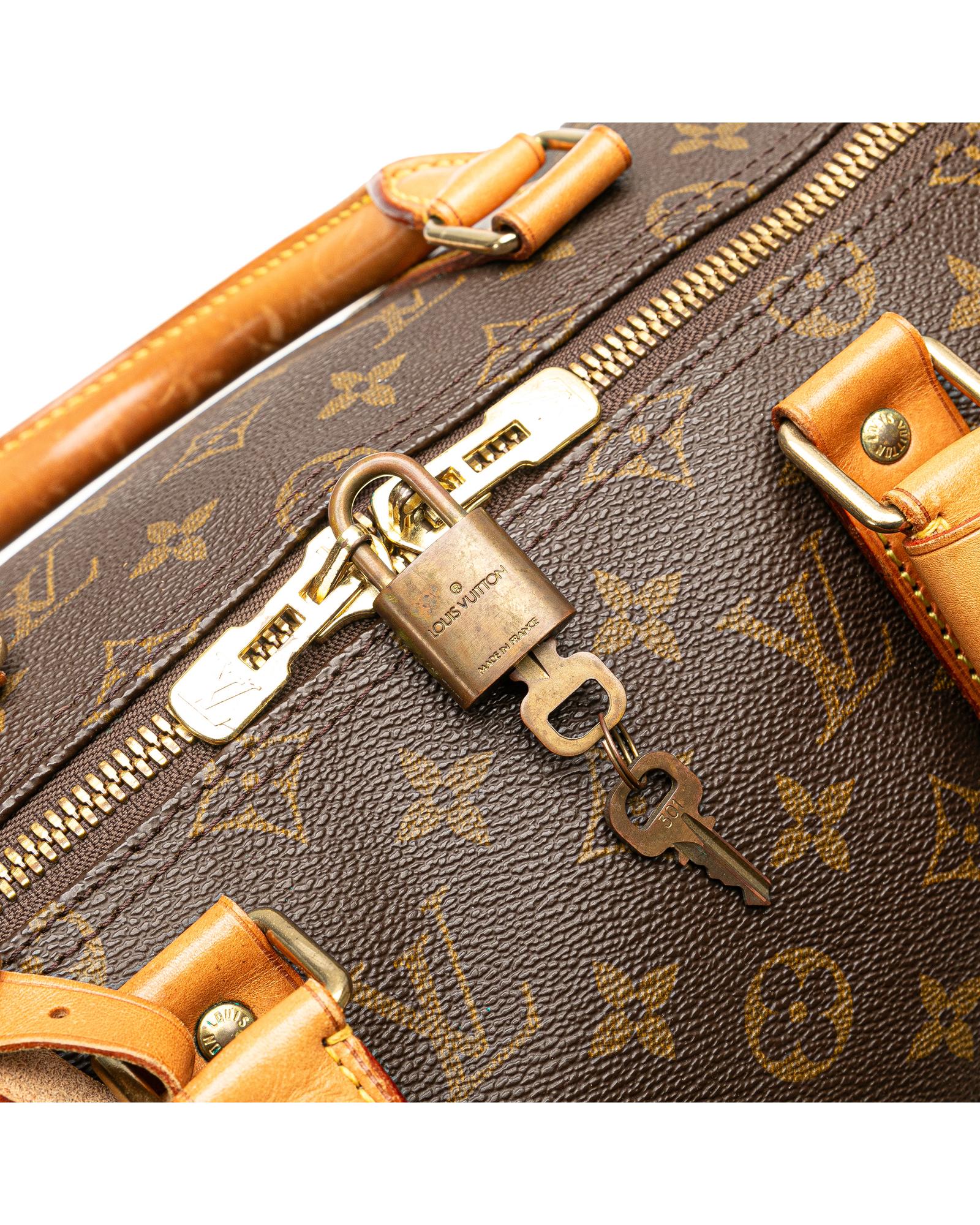 Monogram Canvas Keepall with Vachetta Leather Trim and Top Zip Closure