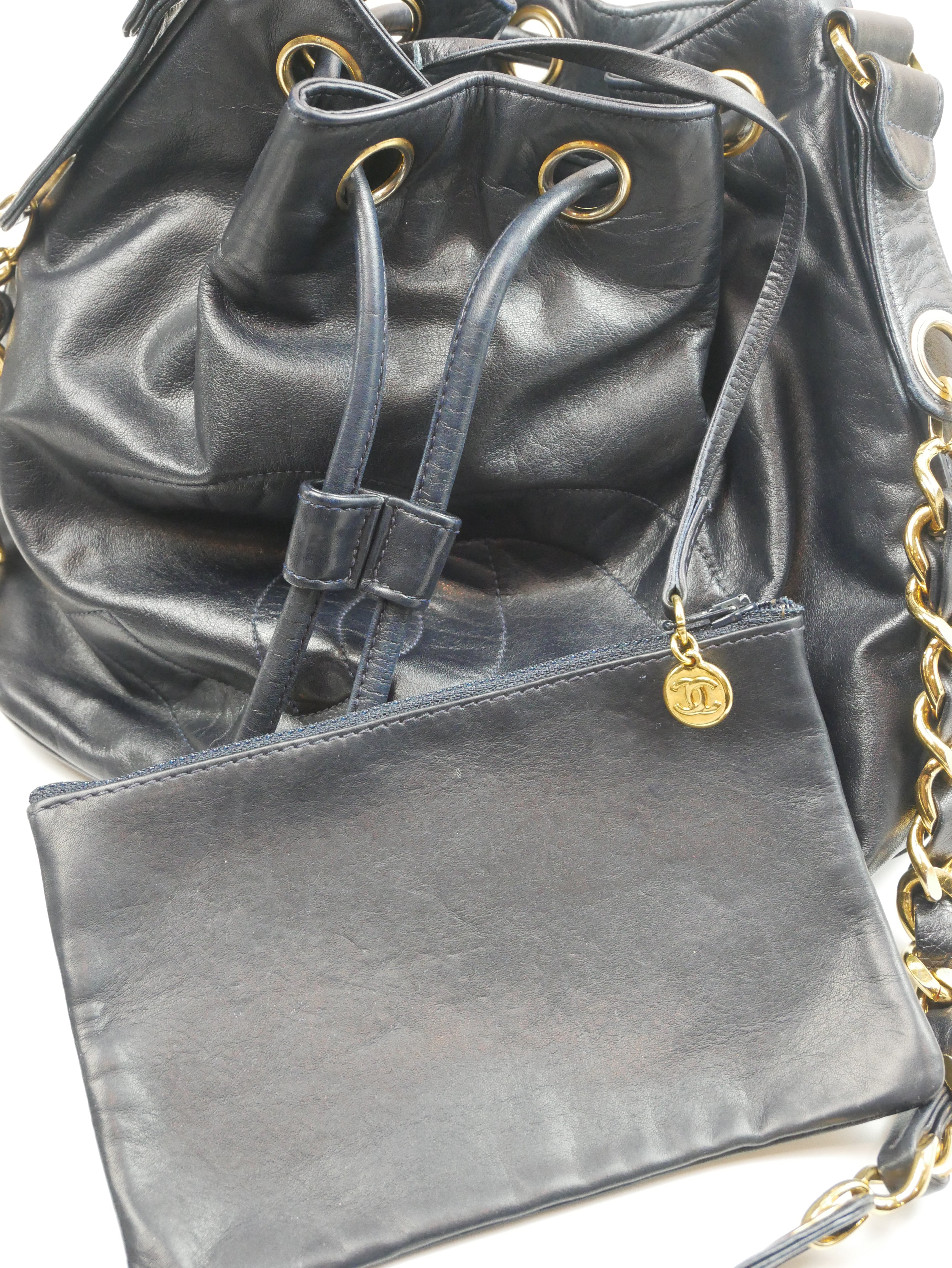 Chanel black bucket bag with logo on the front and gold detail - 1980s