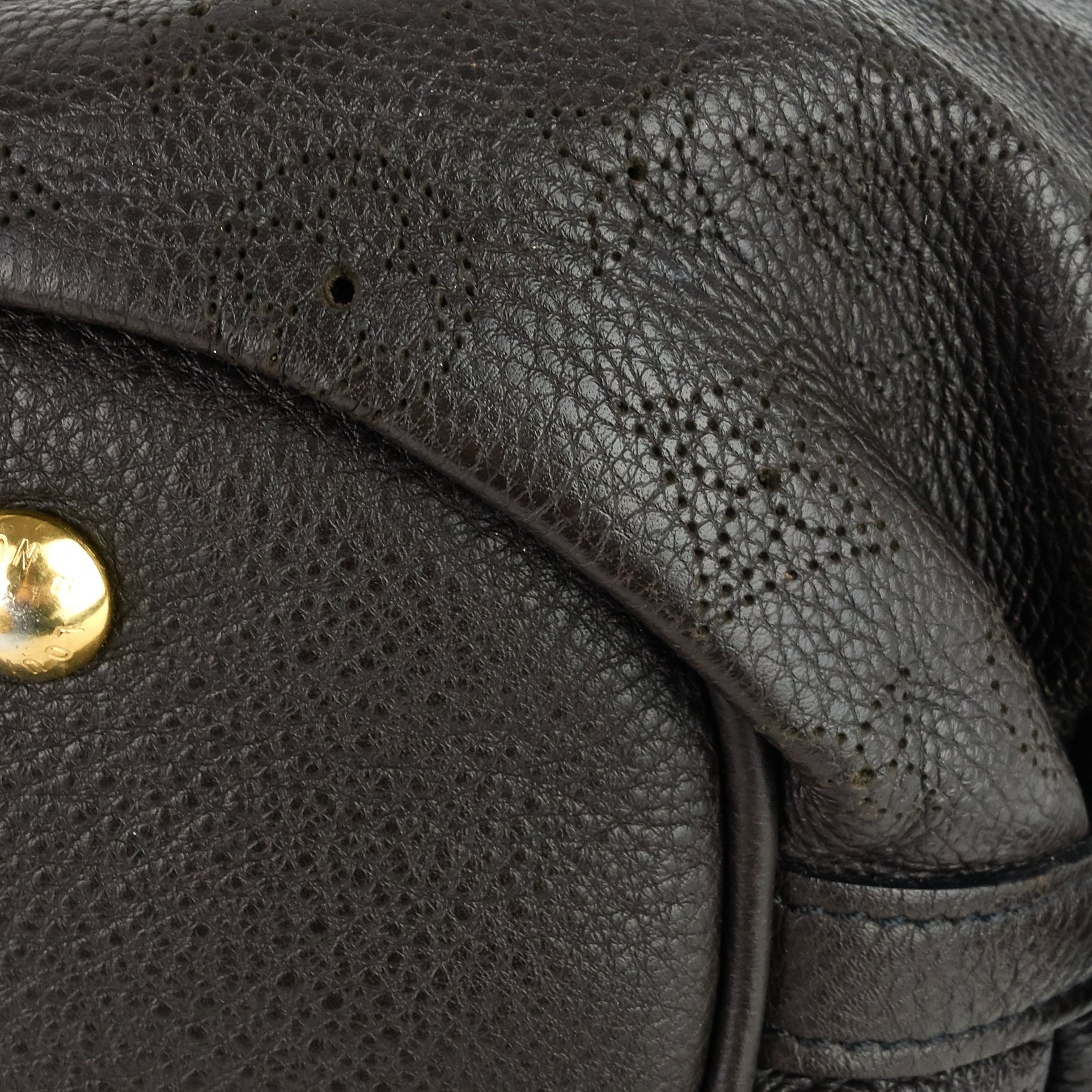 Louis Vuitto Perforated Monogram Mahina Leather XS Bag