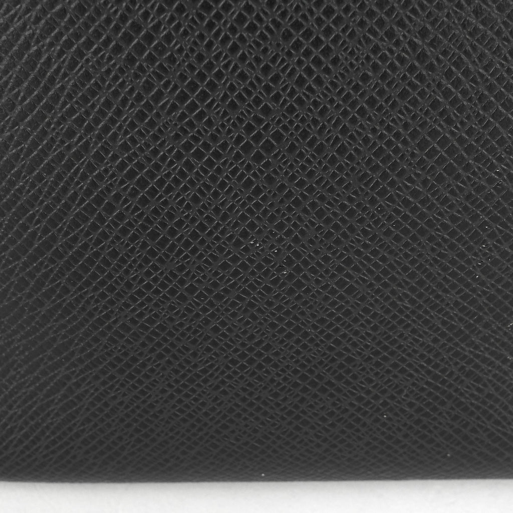 Louis Vuitto Roman MM Taiga Leather Messenger Bag